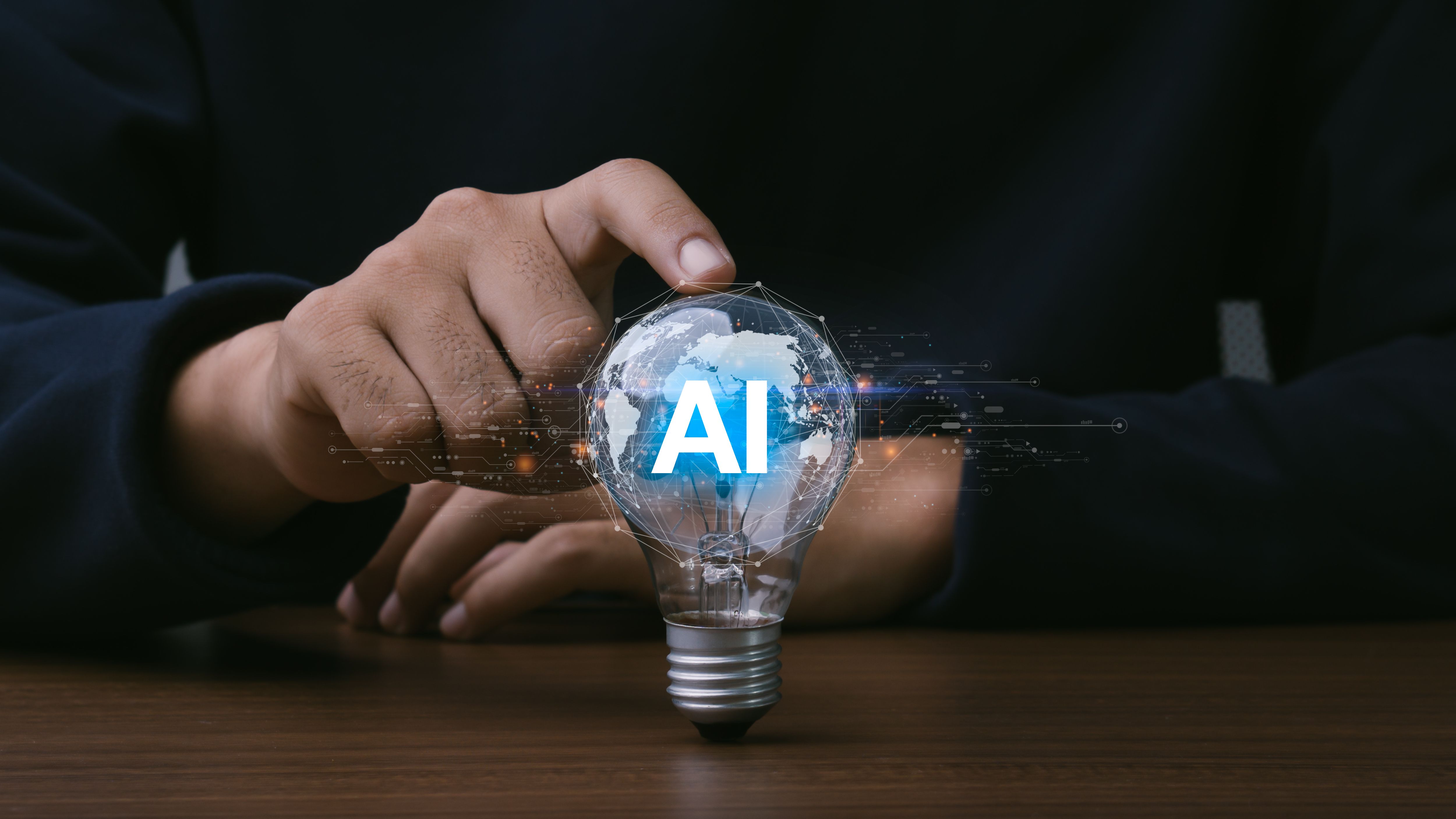 AI (Artificial intelligence) growing concept. Businessman hand holding light bulb with AI word, futuristic technology idea. AI (Artificial intelligence) growing concept. Businessman hand holding light bulb with AI word, futuristic technology idea.