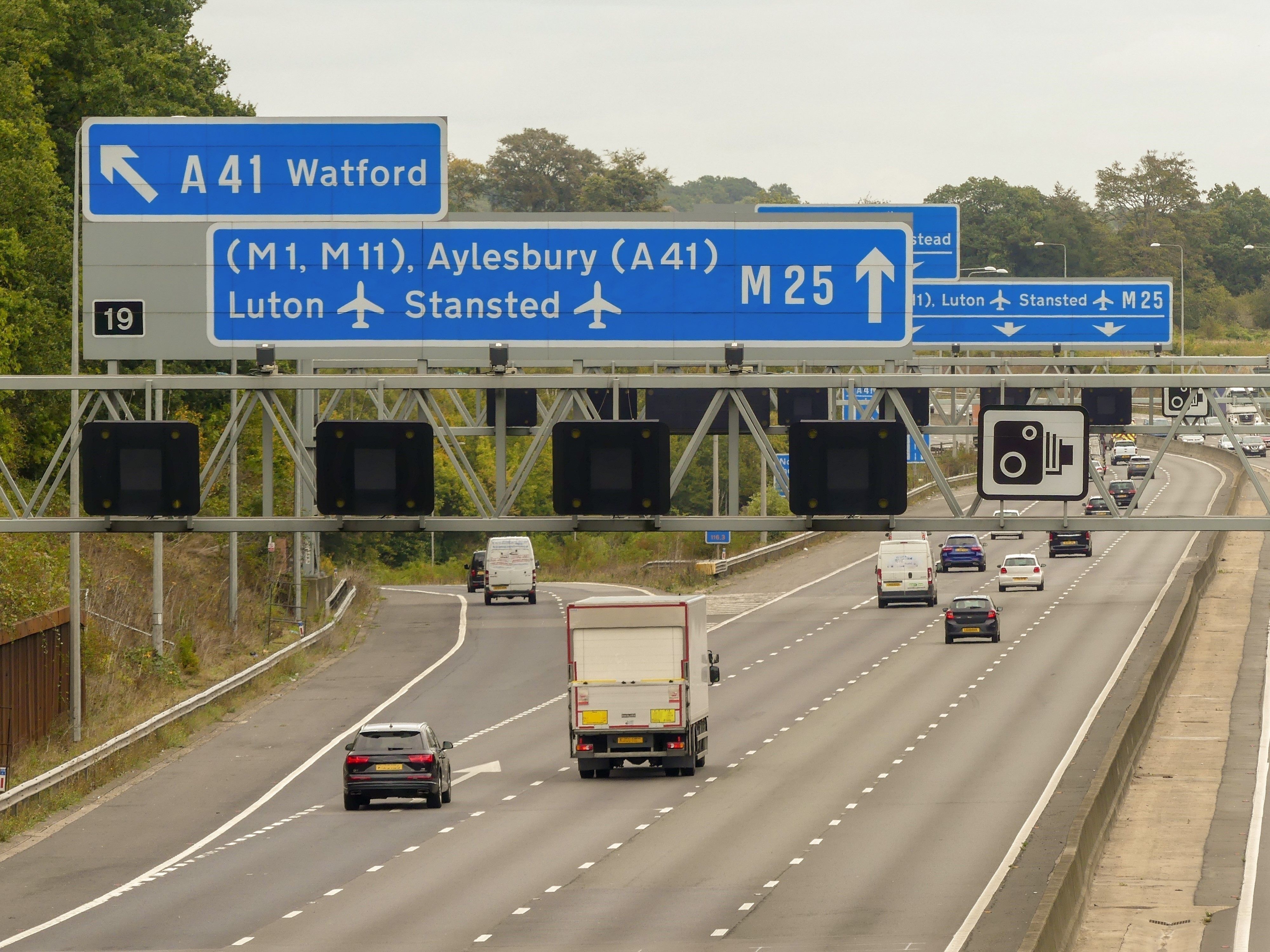 M25 London Orbital Motorway signs at Junction 19 for Watford A41, Luton Airport M1, Stansted Airport M11 and Aylesbury A41