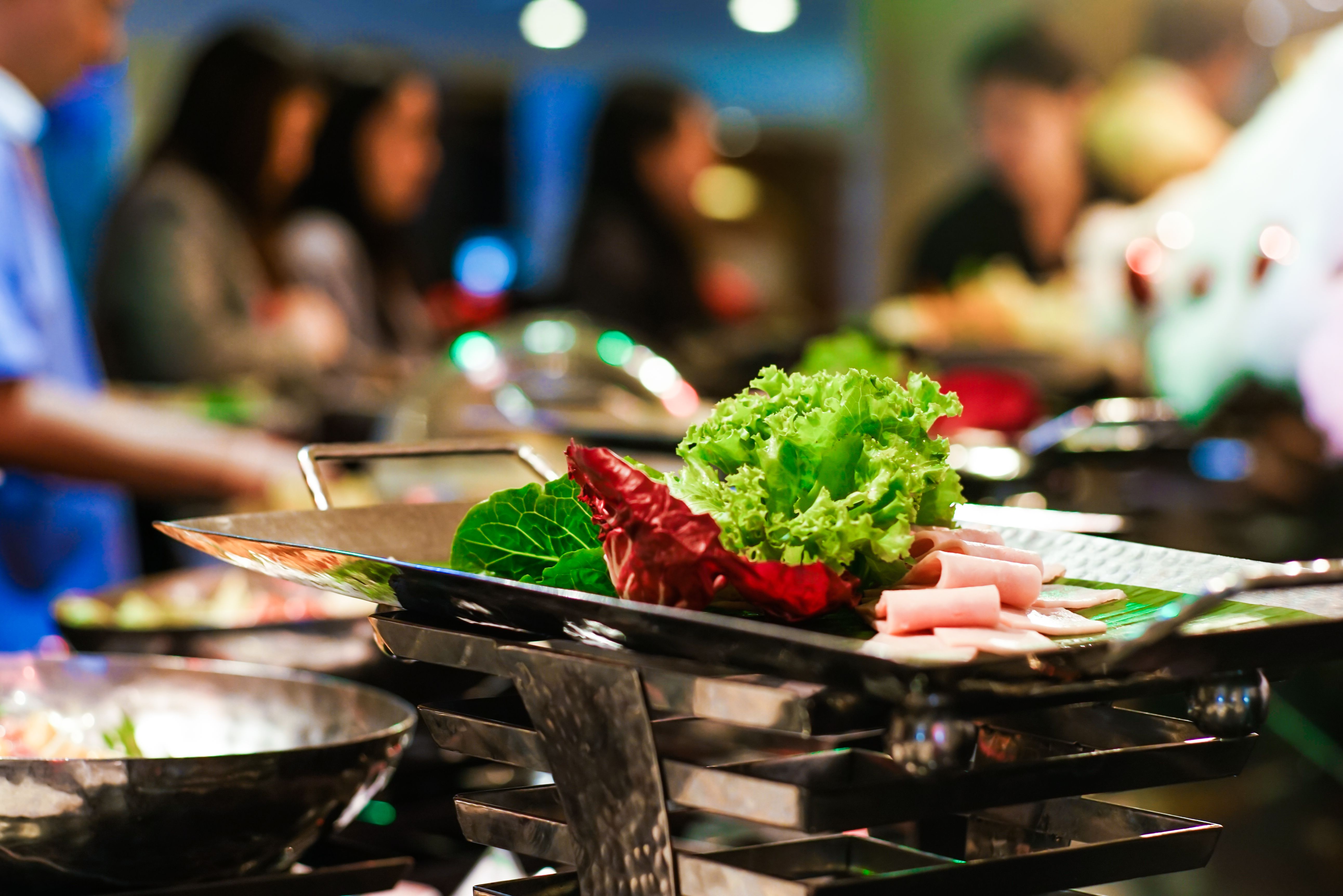 Hand of people grab buffet food self serving in hotel seminar