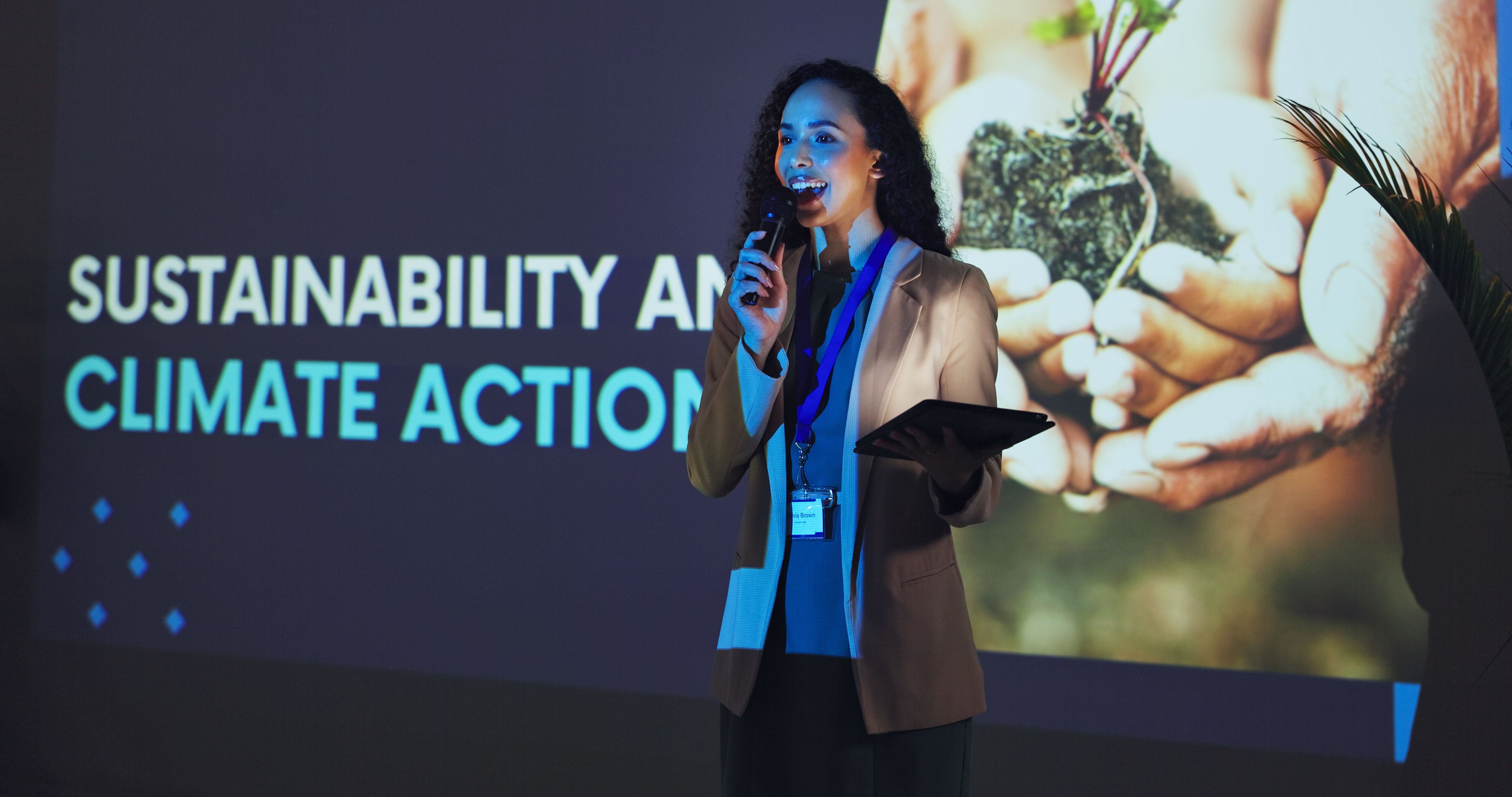 Presentation, workshop and woman on a stage for climate change tradeshow, convention and seminar. Public speaker, audience and person with tablet at event for environment, sustainability and farming