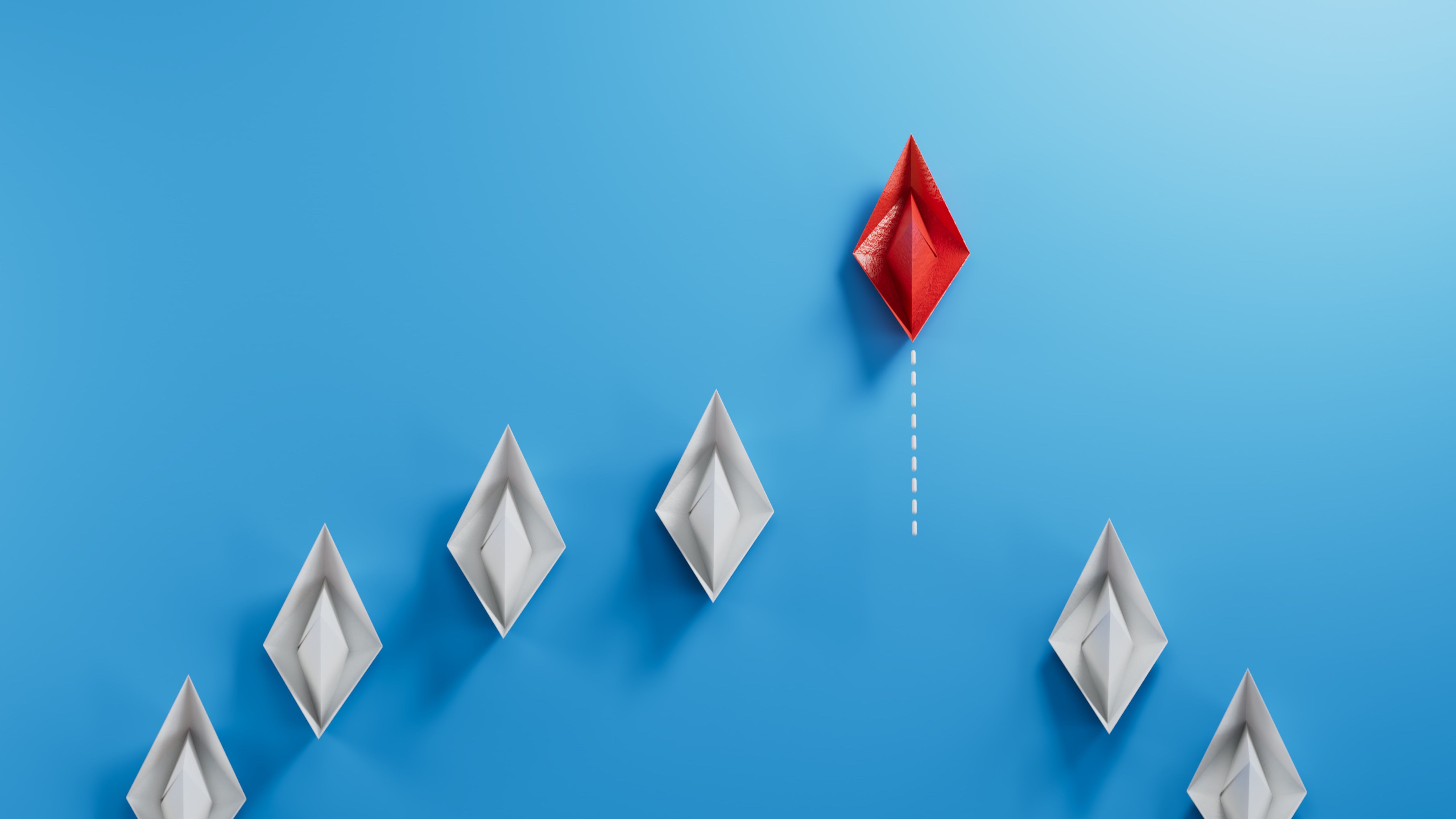 Business concept for new ideas creativity, innovative solution and Leaderboat concept with blue paper boat leading among white.3D rendering on blue background. Business concept for new ideas creativity, innovative solution and Leaderboat concept with blue paper boat leading among white.3D rendering on blue background.