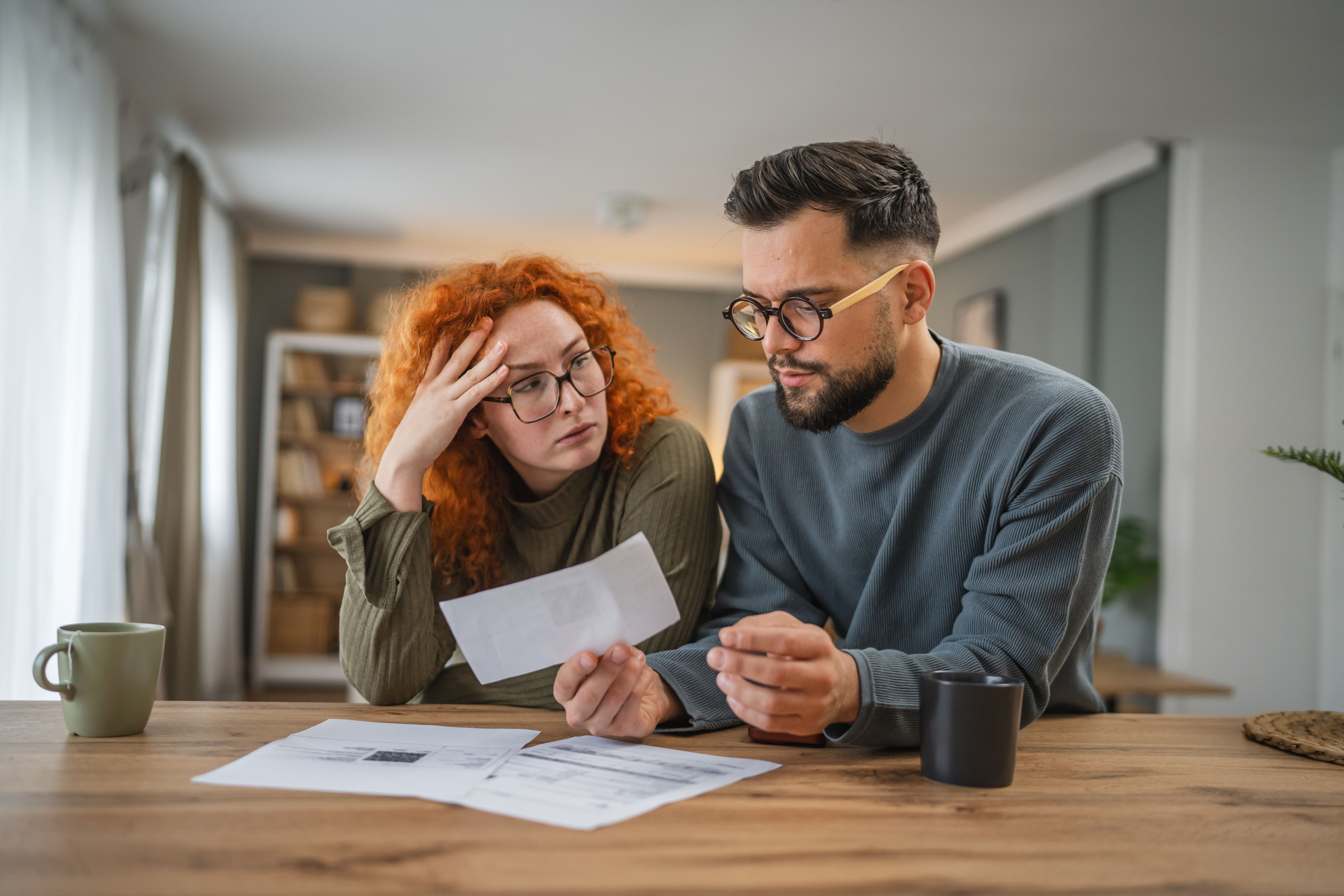 couple analysis bills and home budget and have contactless payment couple analysis bills and home budget and have contactless payment