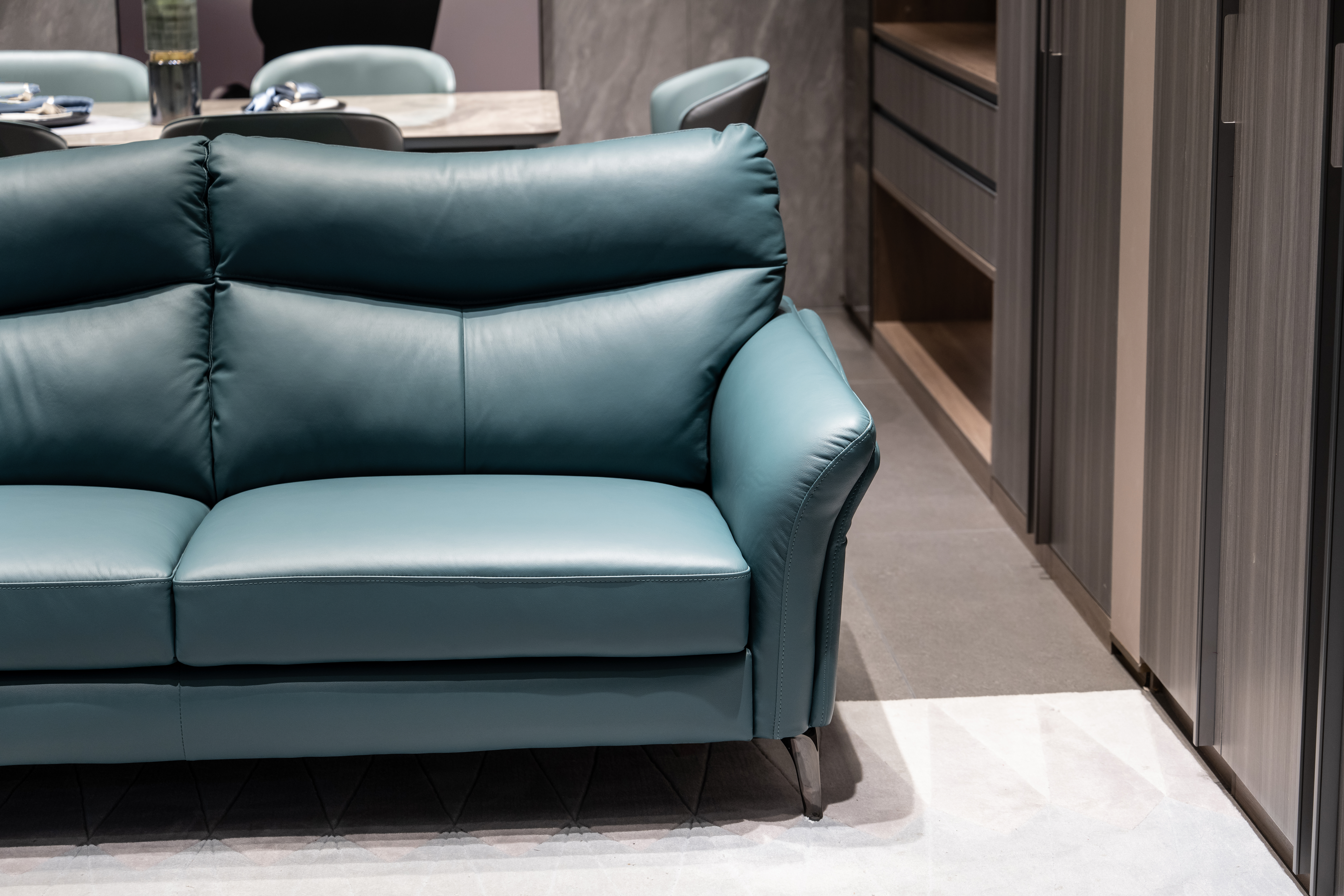 Partial close-up of the blue sofa in the living room