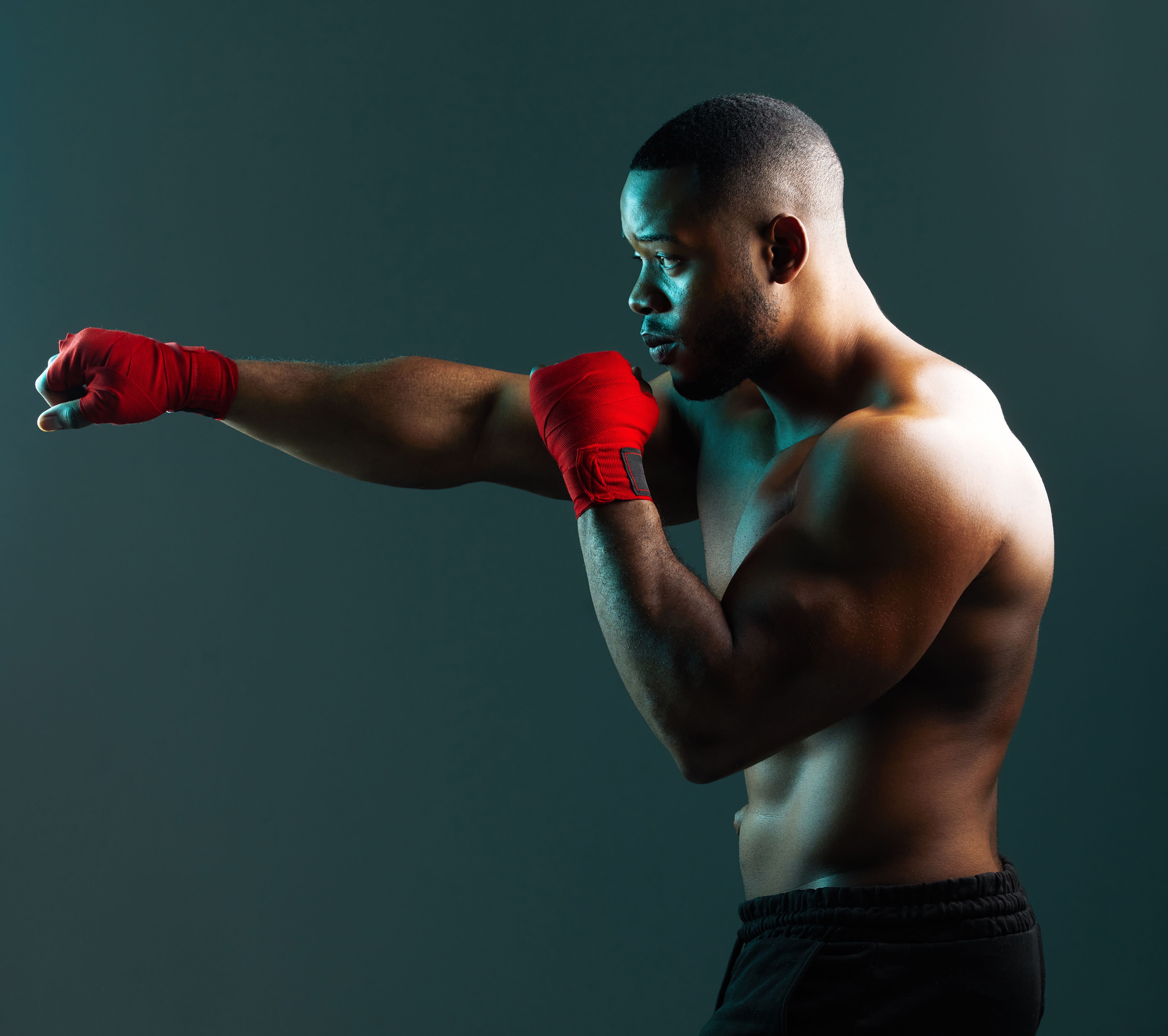 Shot of a handsome young man boxing against a studio background