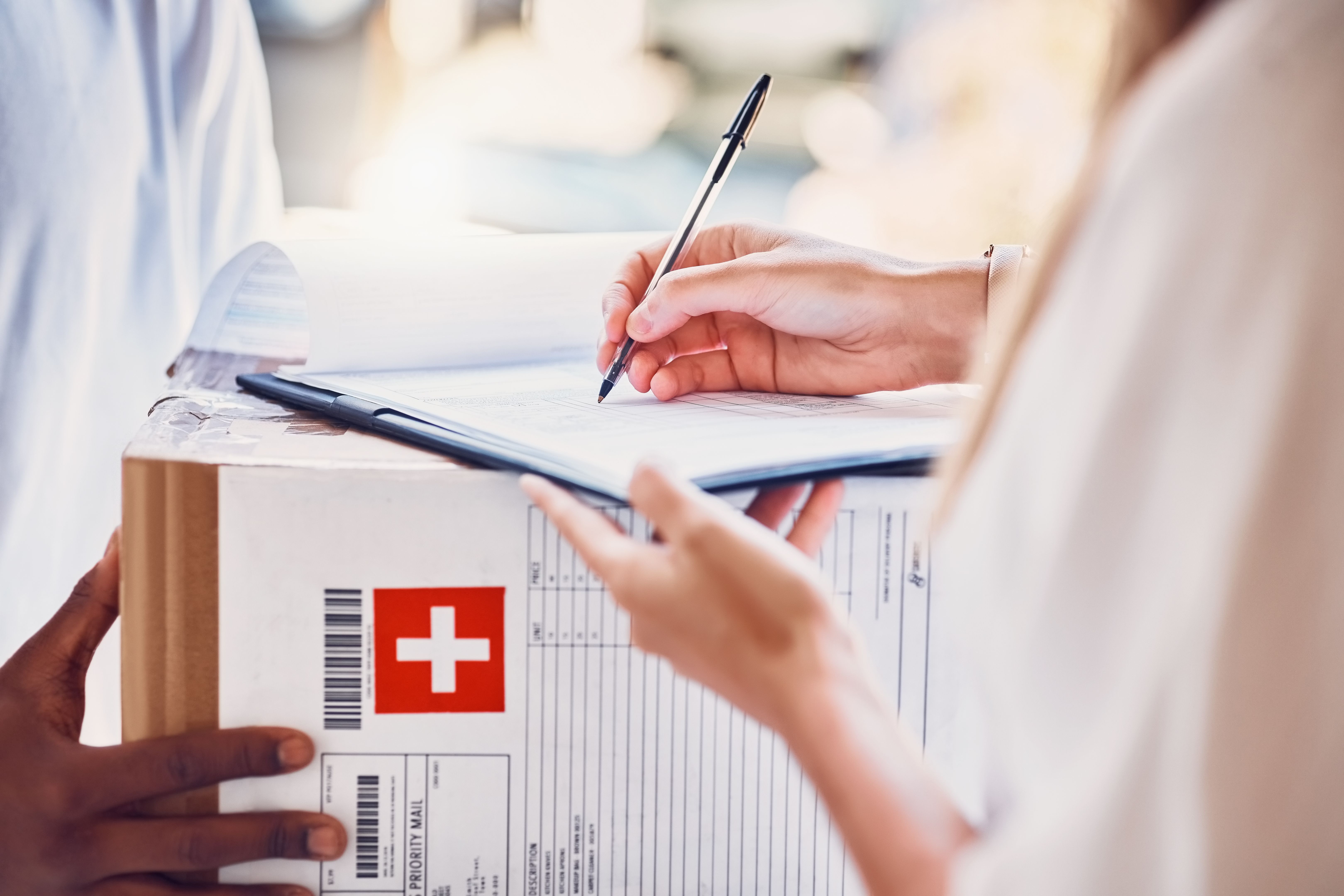 Delivery, signature and box parcel for a customer for an online order or ecommerce medicine shopping. Cargo, shipping and courier driver giving a medical package to a woman for signage at front door.