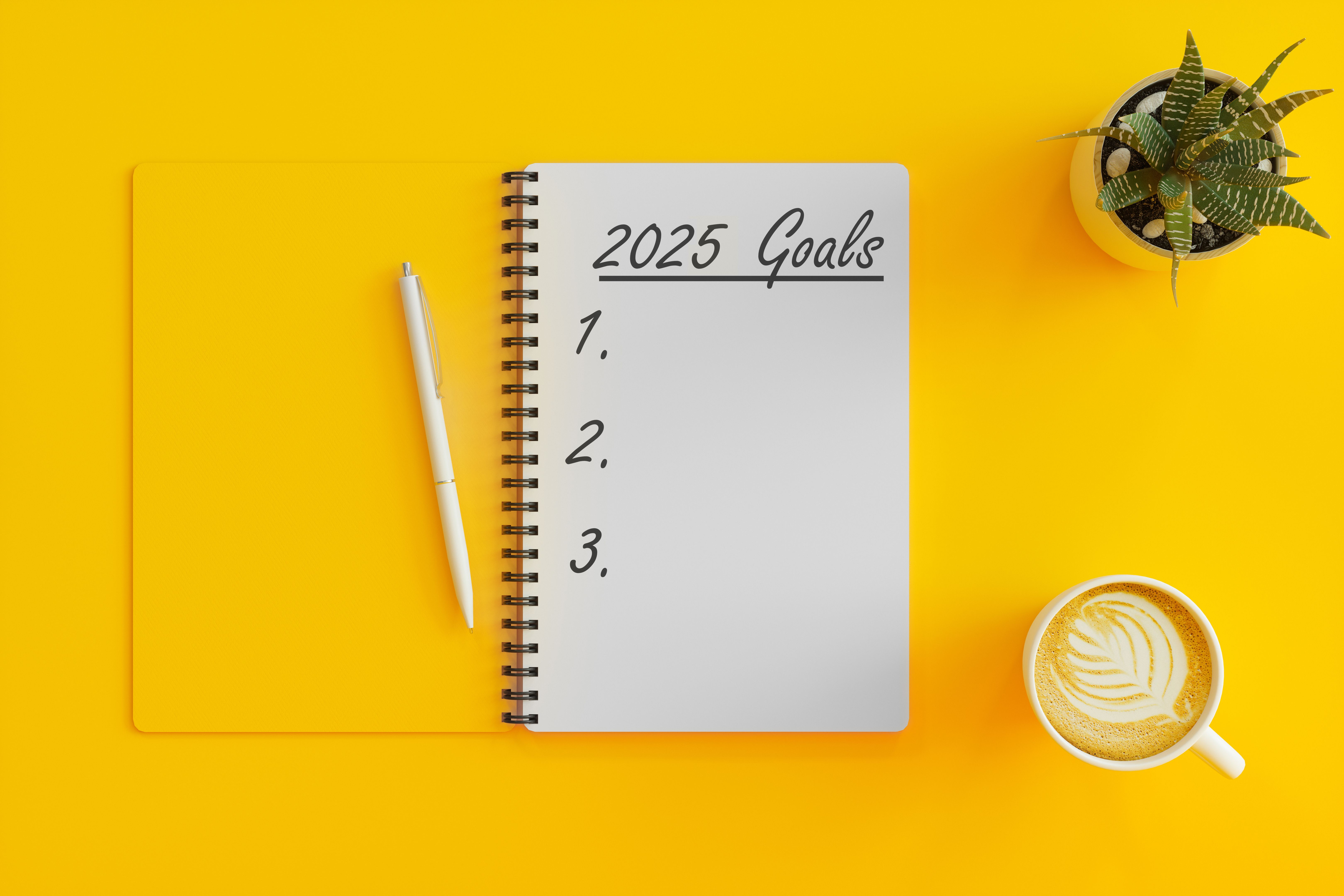 2025 New Year Goals Concept. High Angle View Of 2025 Goals List With Notebook, Coffee Cup And Succulent Plant On Yellow Background