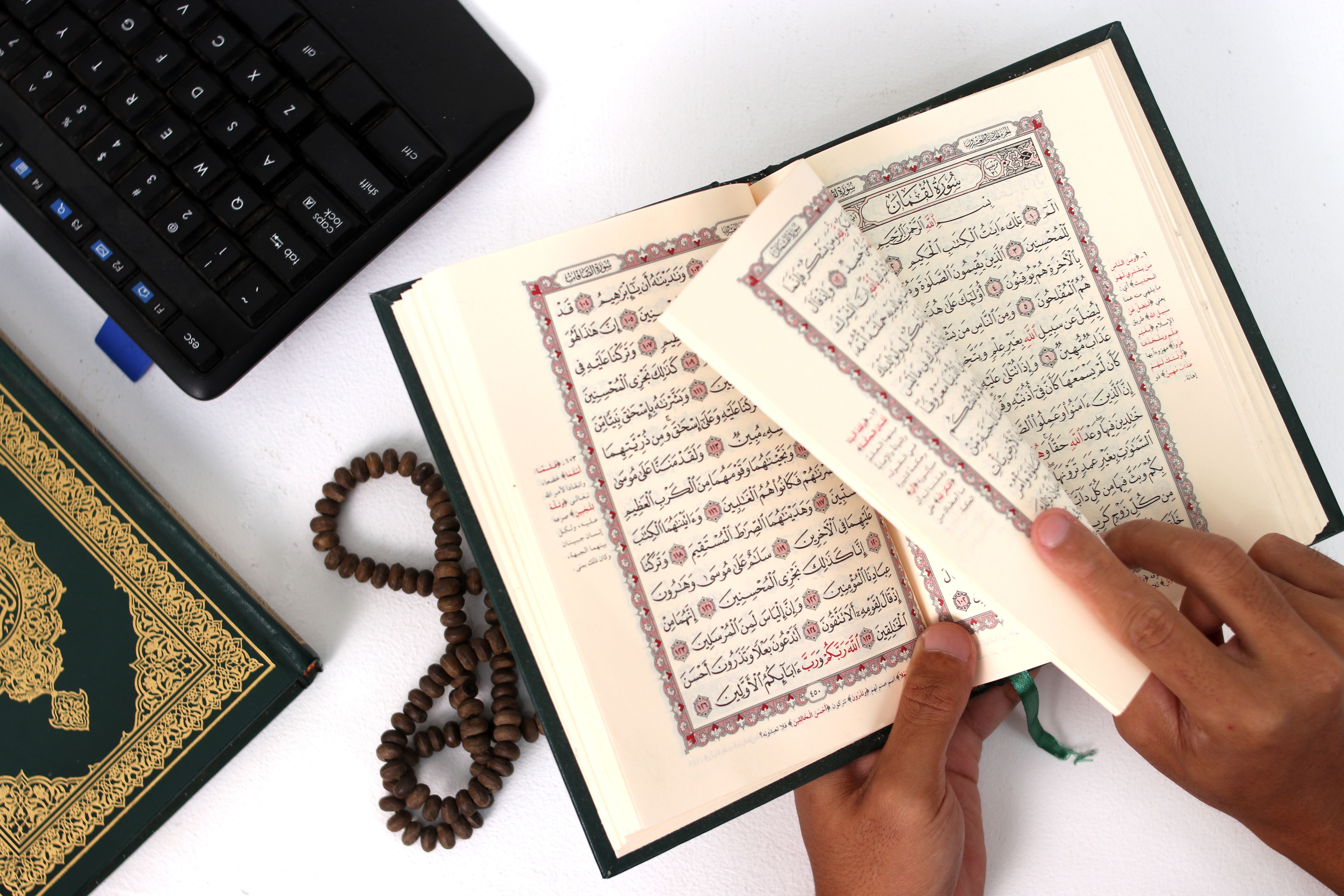 Indonesian Muslim Worker Recites Quran During Ramadan Break