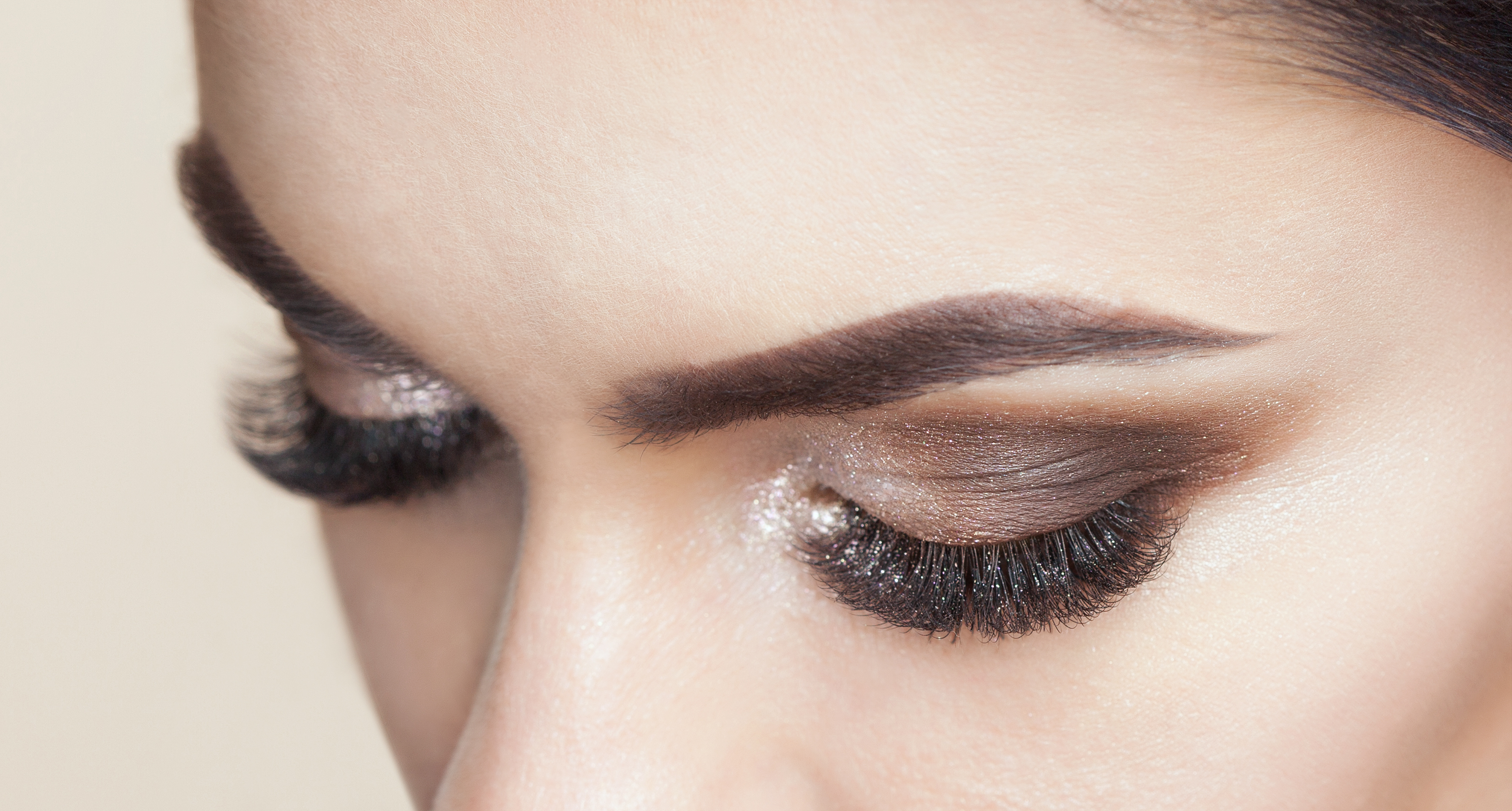 Beautiful woman with long eyelashes and with beautiful smokey eyes make-up.