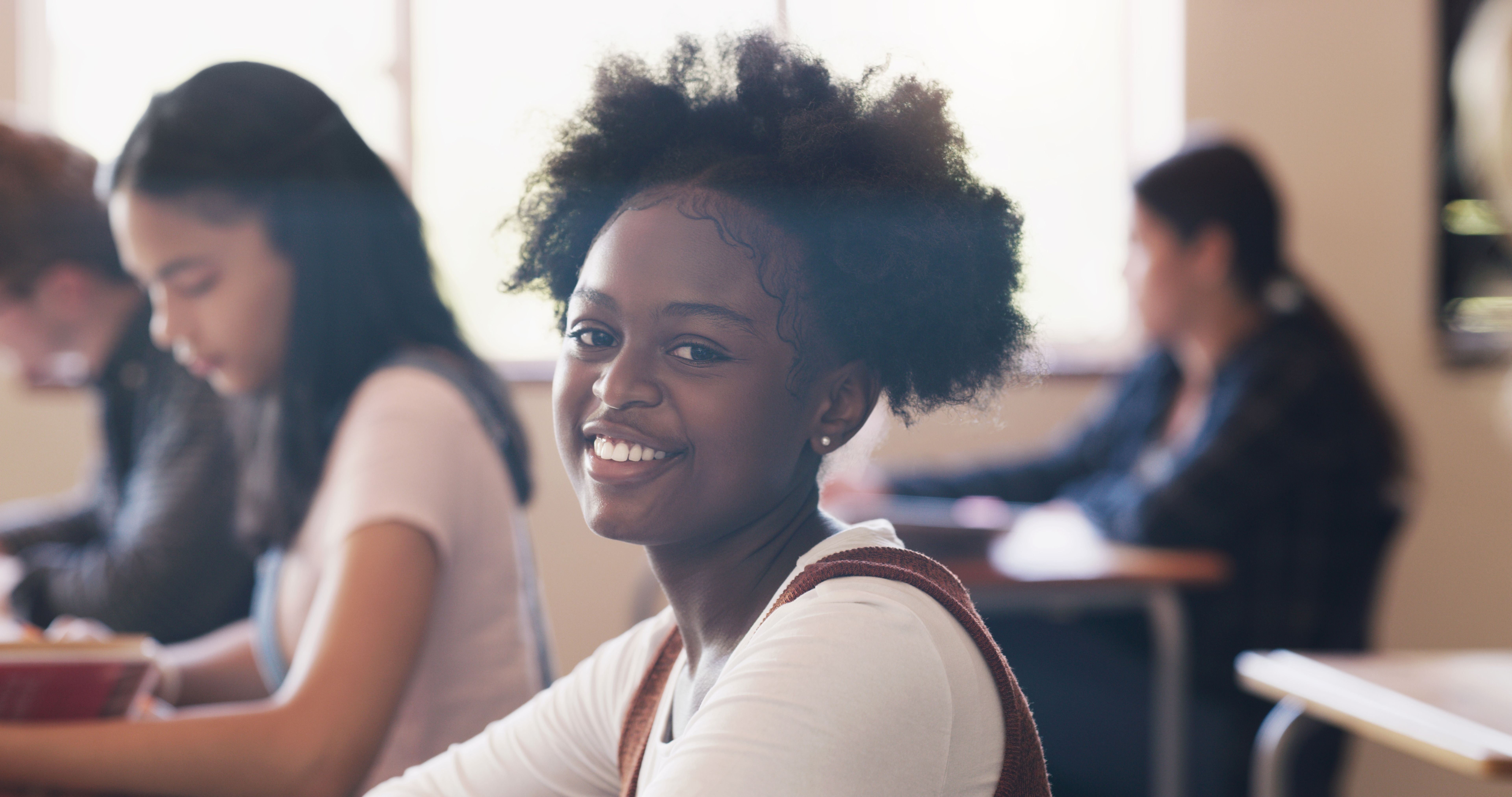 Portrait of a teenage girl in a classroom at high school Portrait of a teenage girl in a classroom at high school