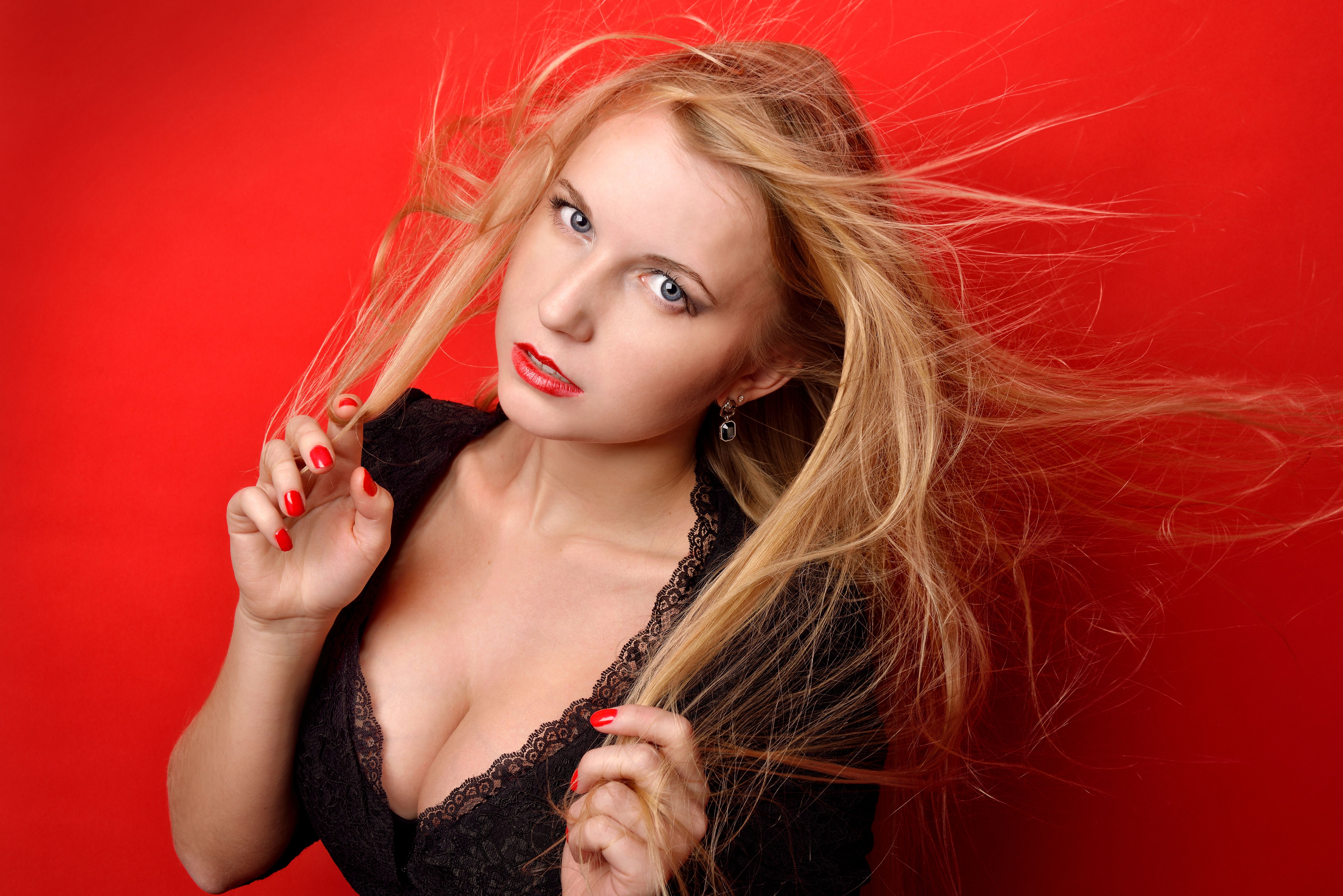 beautiful blonde  woman in black dress with ajar breast