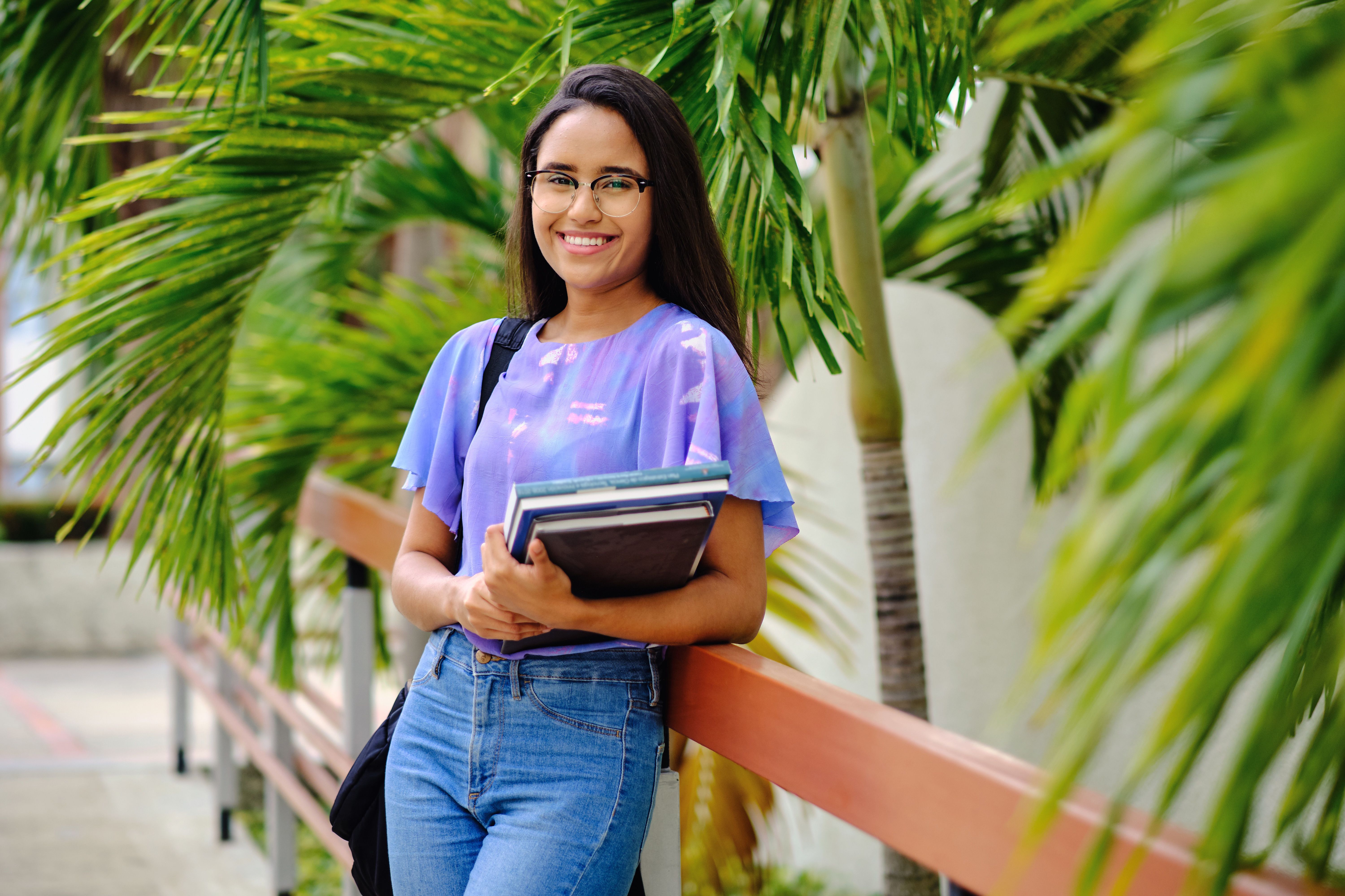 Student girl smiling and happy in university campus garden