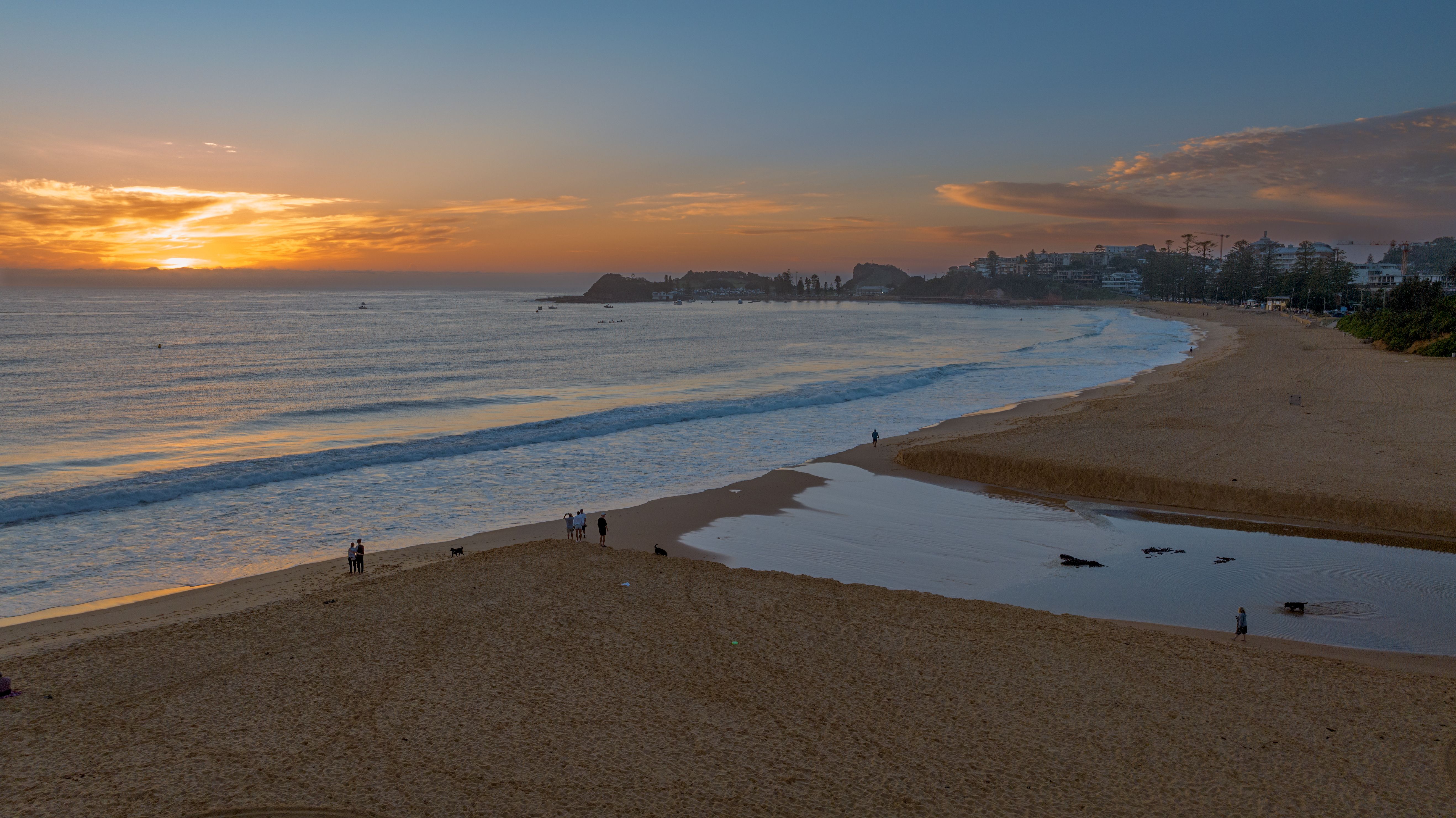 sunset-beach-scenery-surfers-peaceful-moment