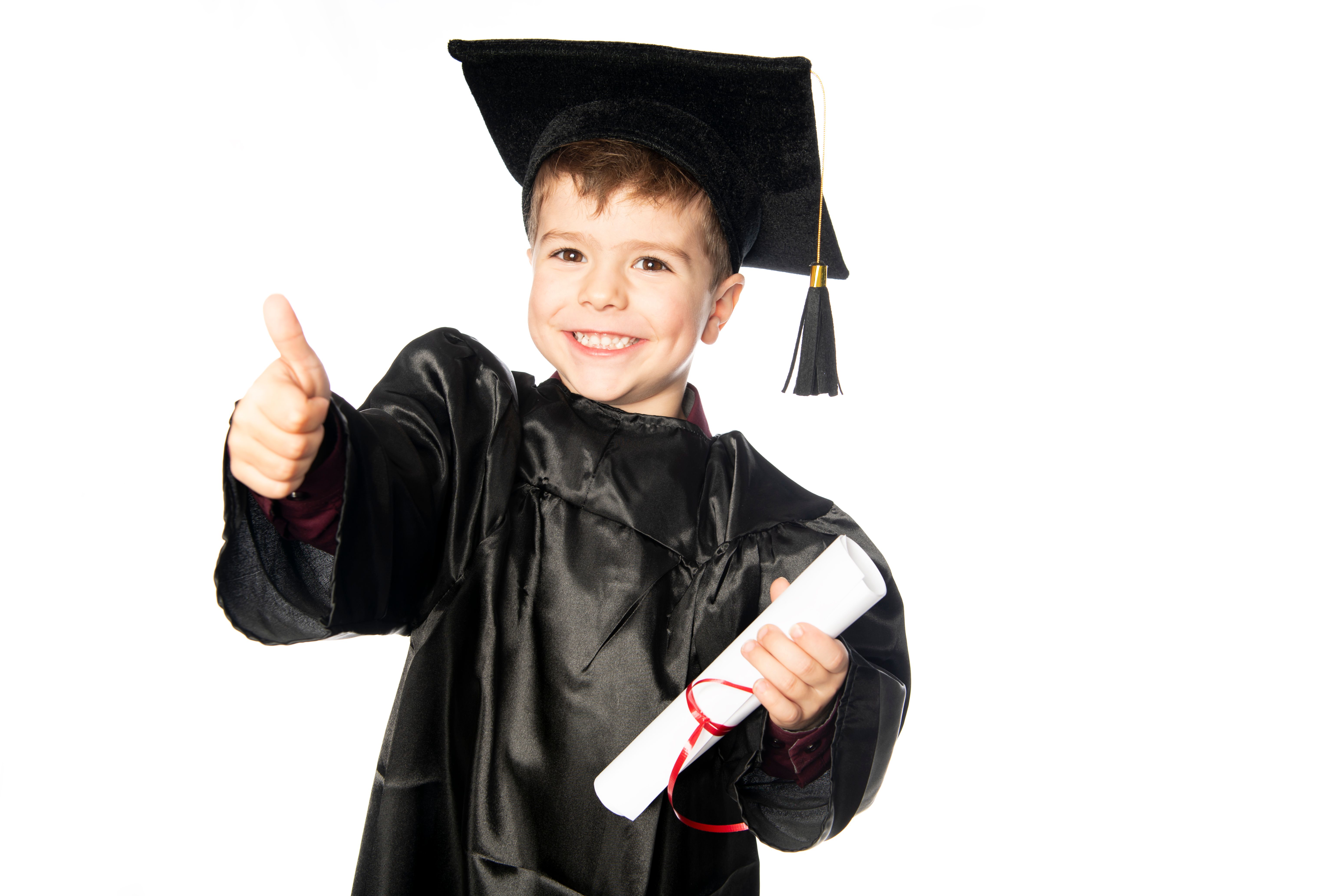 A Young boy 4 years old in graduation dress