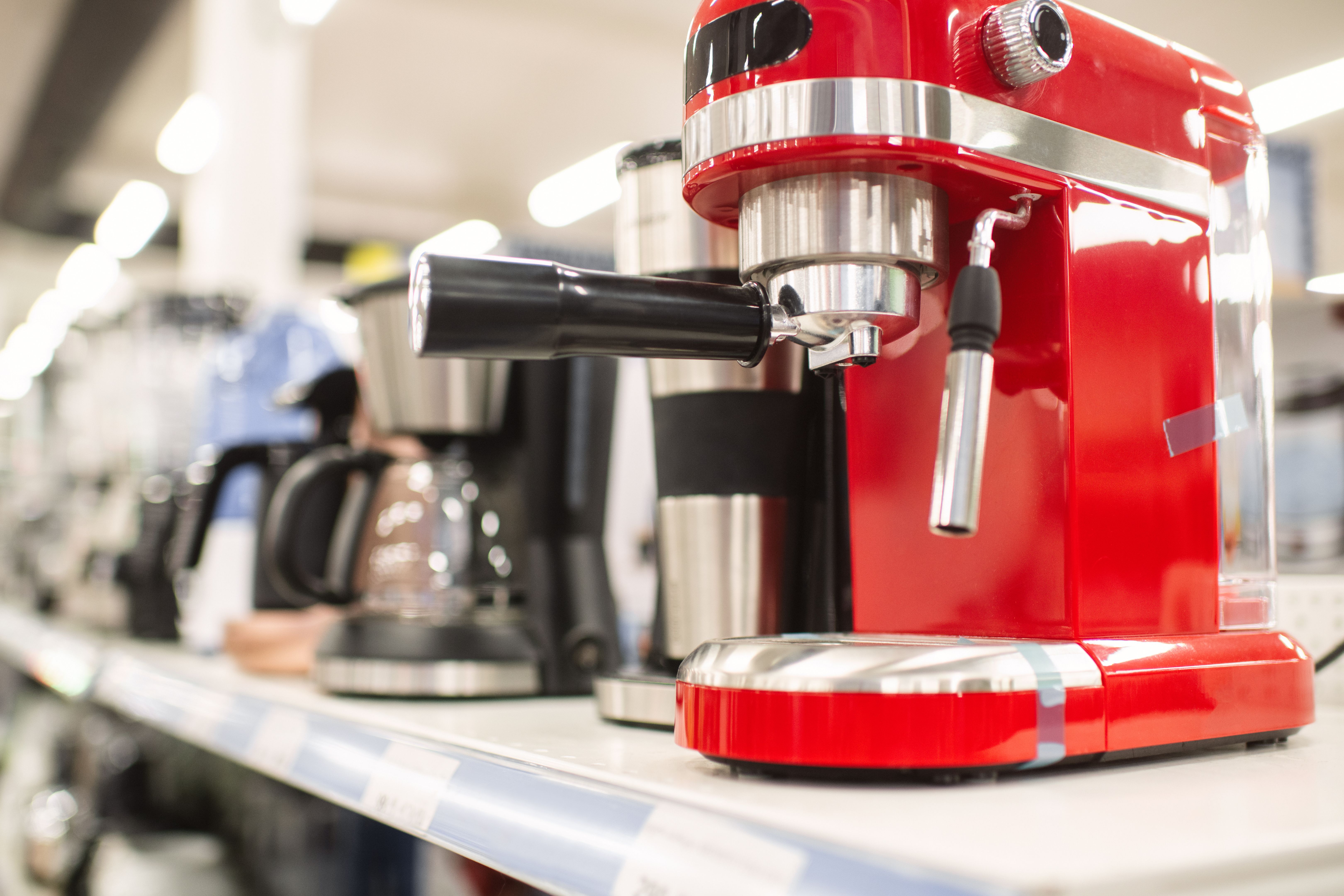 Coffee machines on a shelf for sale in a department store or showroom