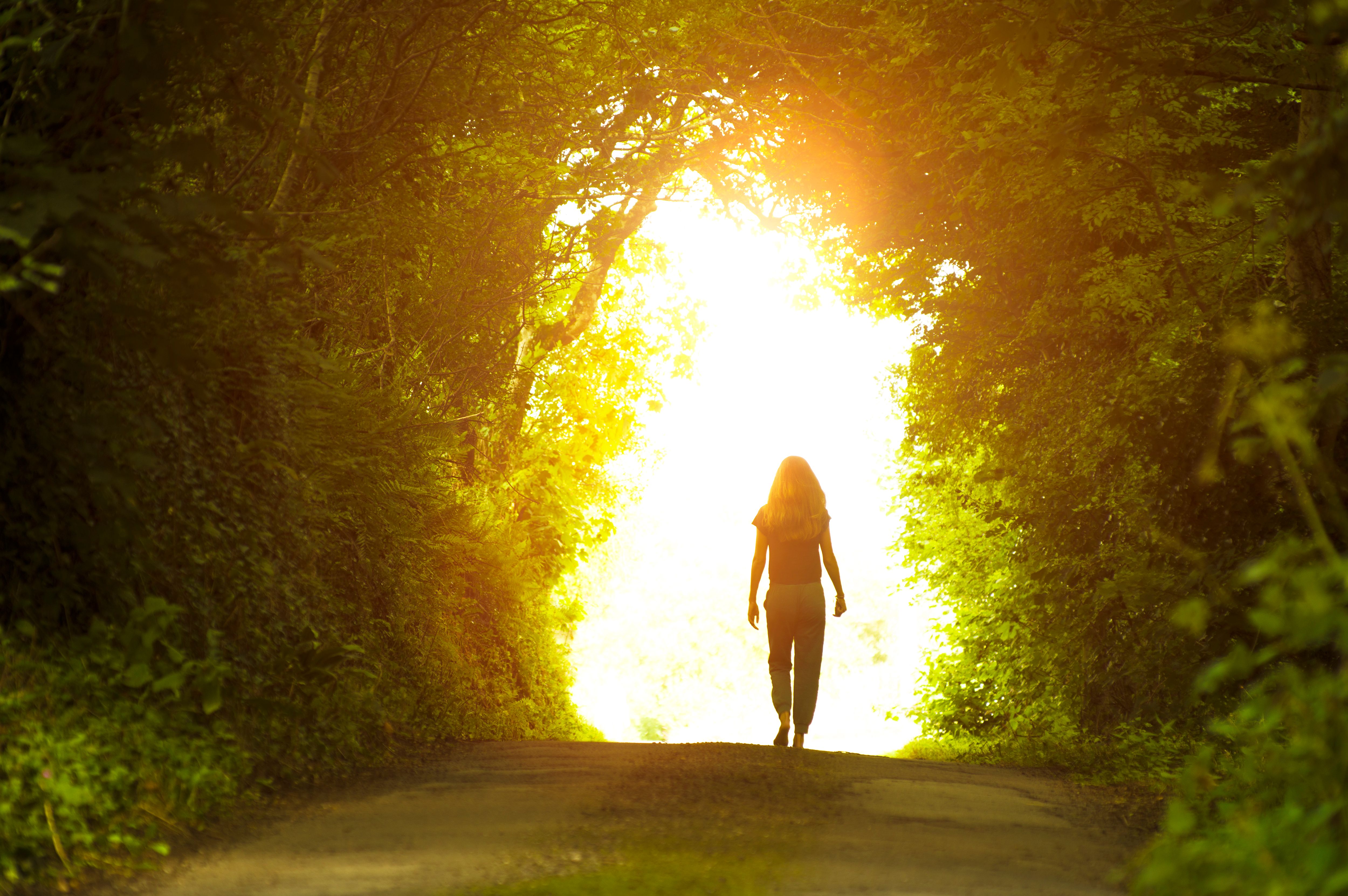 Girl walking towards the light