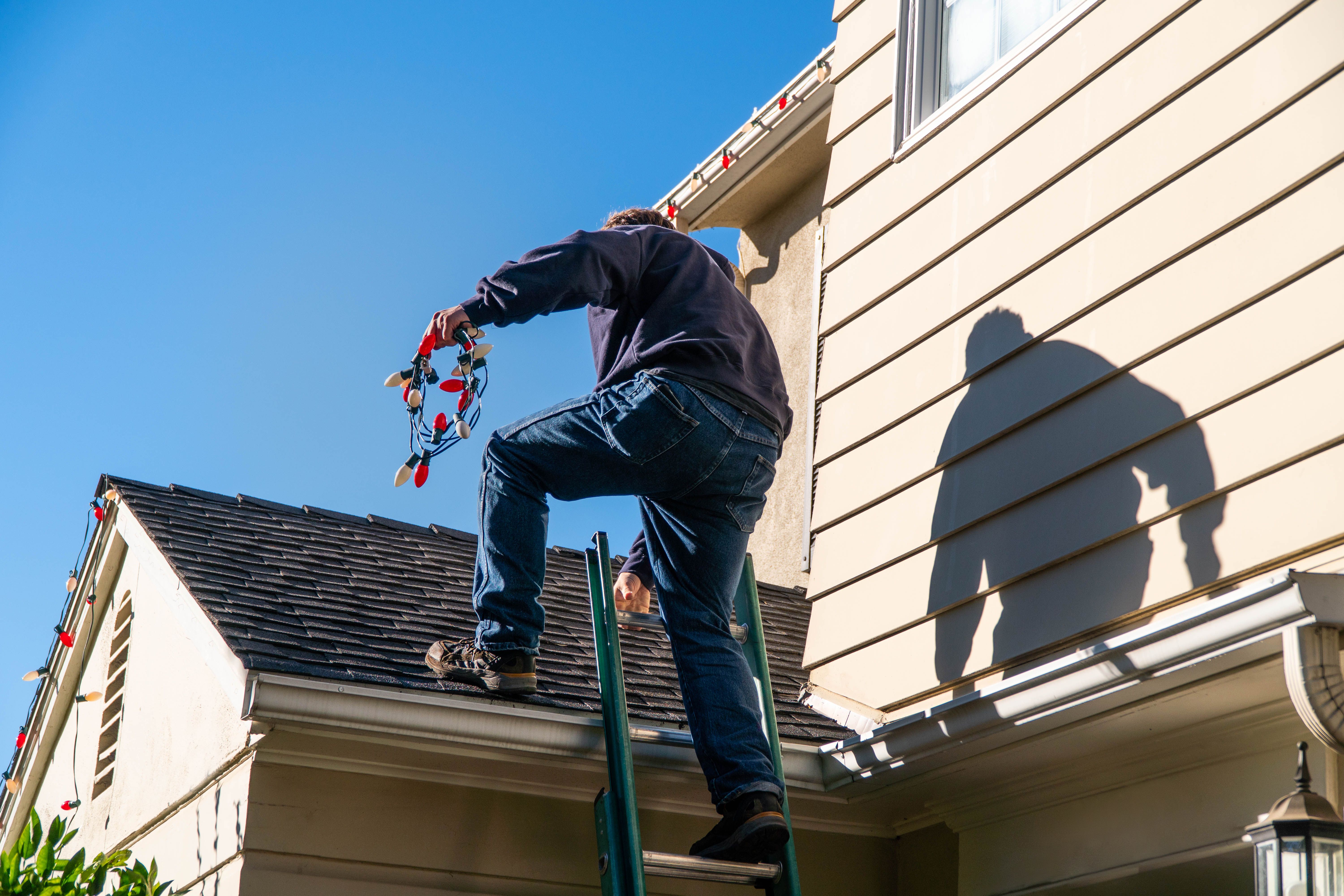 Workman Installing Christmas Lights