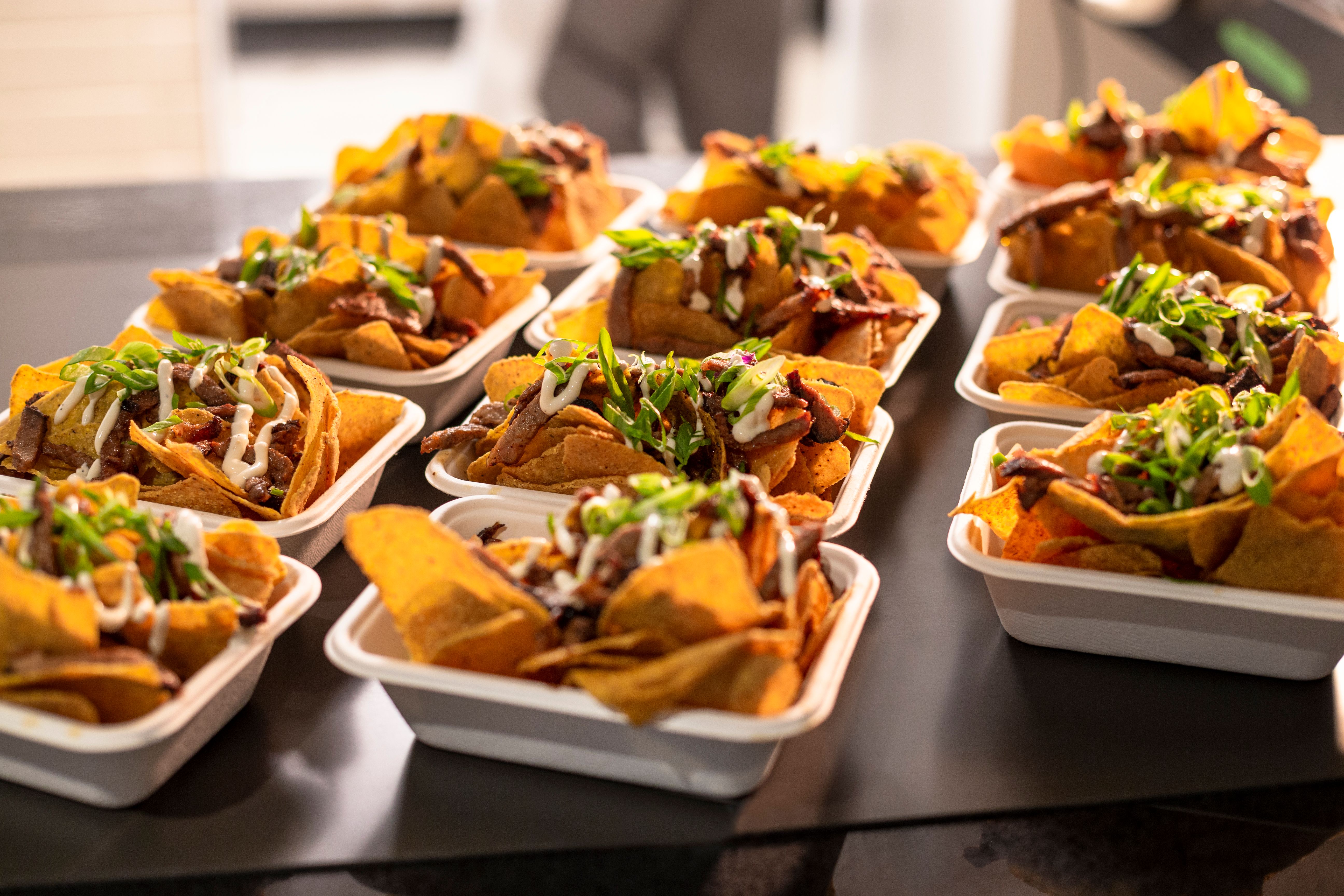 Bar appetizer nacho take out food on a counter