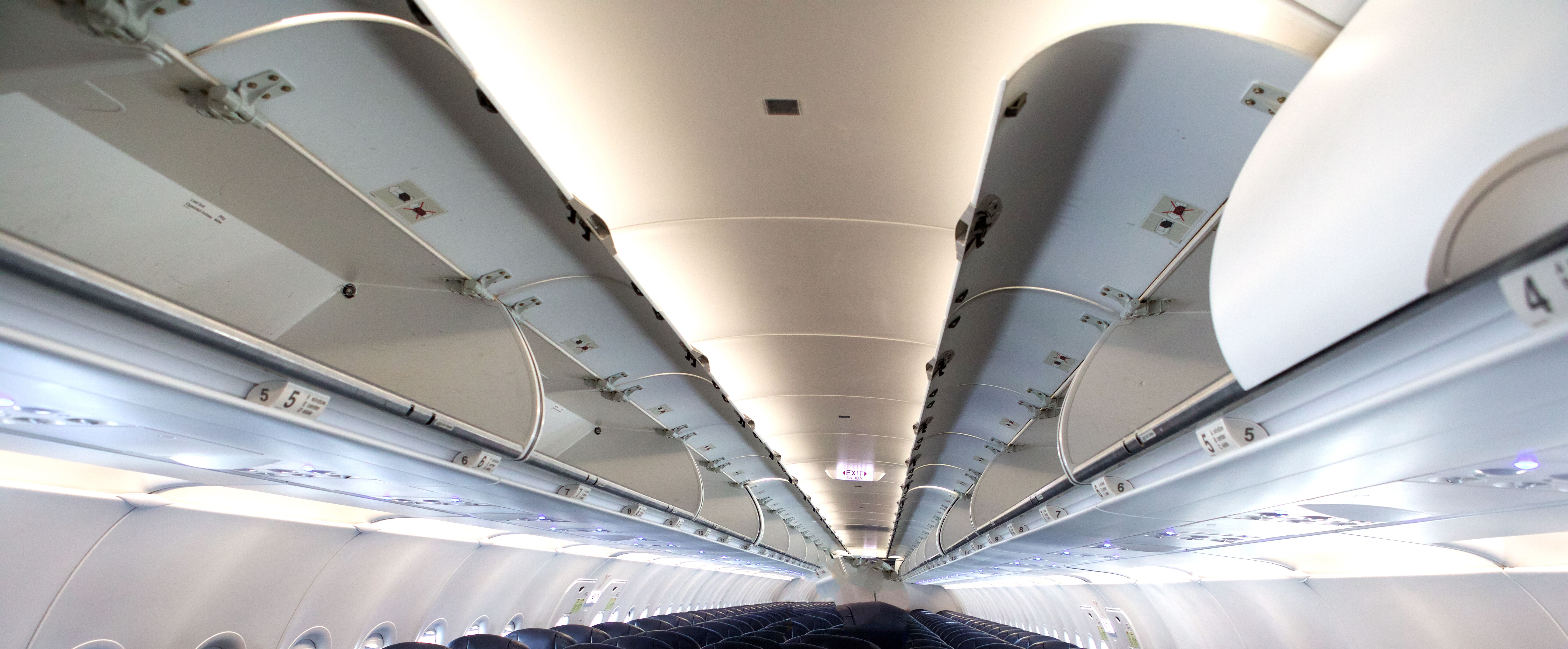 Overhead luggage storage on empty airplane Overhead luggage storage on empty airplane