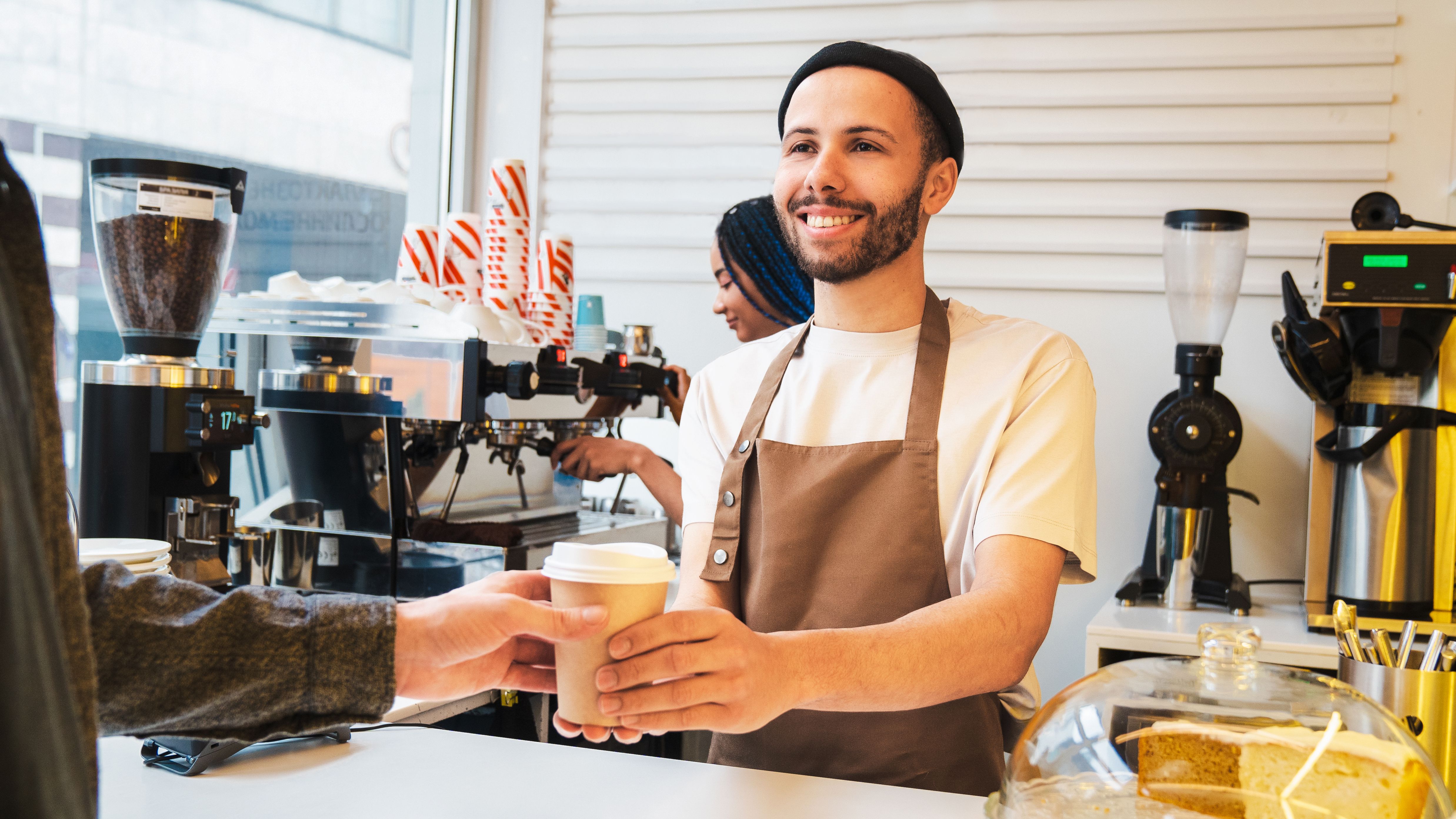 barista serving coffee