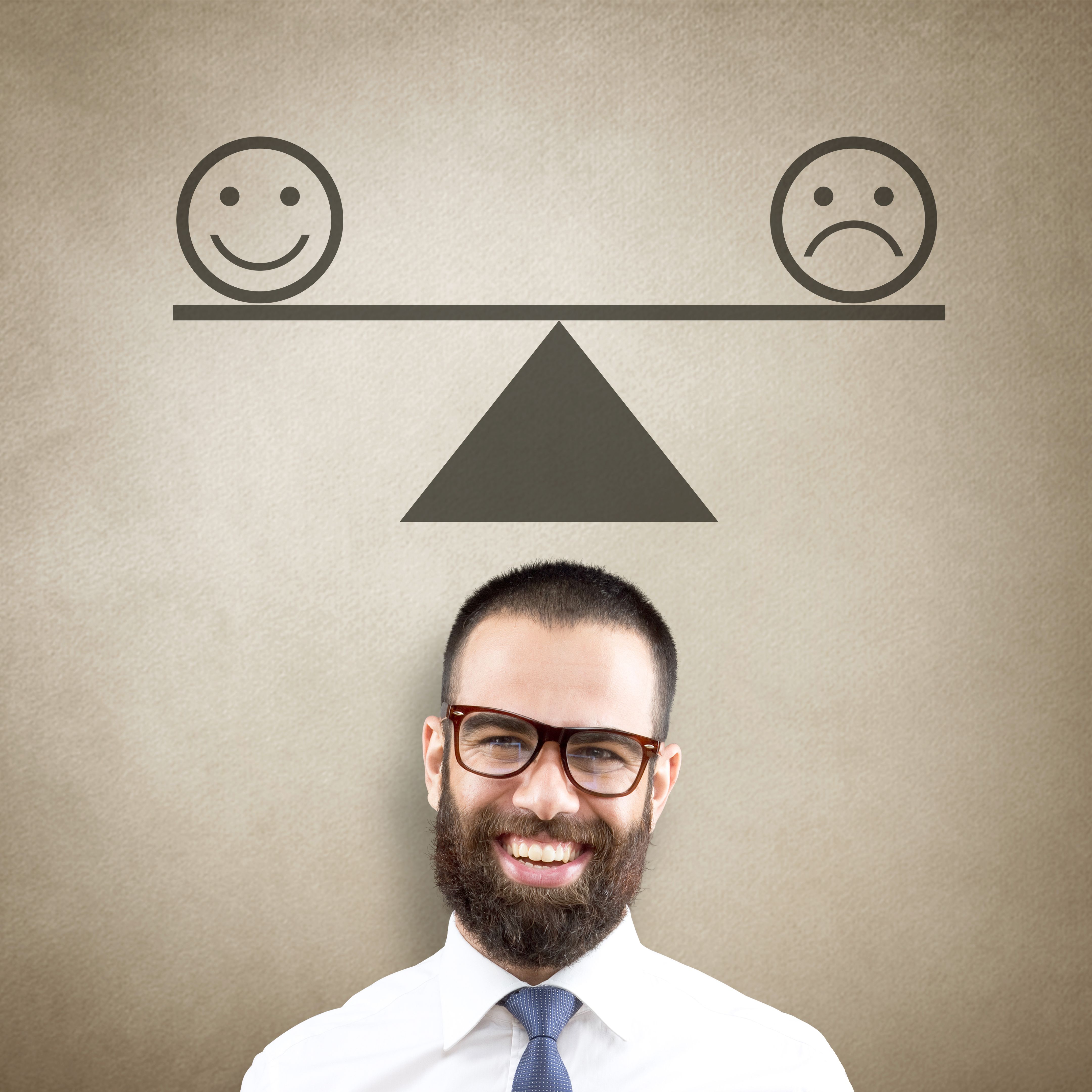 Businessman with happy and unhappy smiley emoticon on weight scale Businessman with happy and unhappy smiley emoticon on weight scale