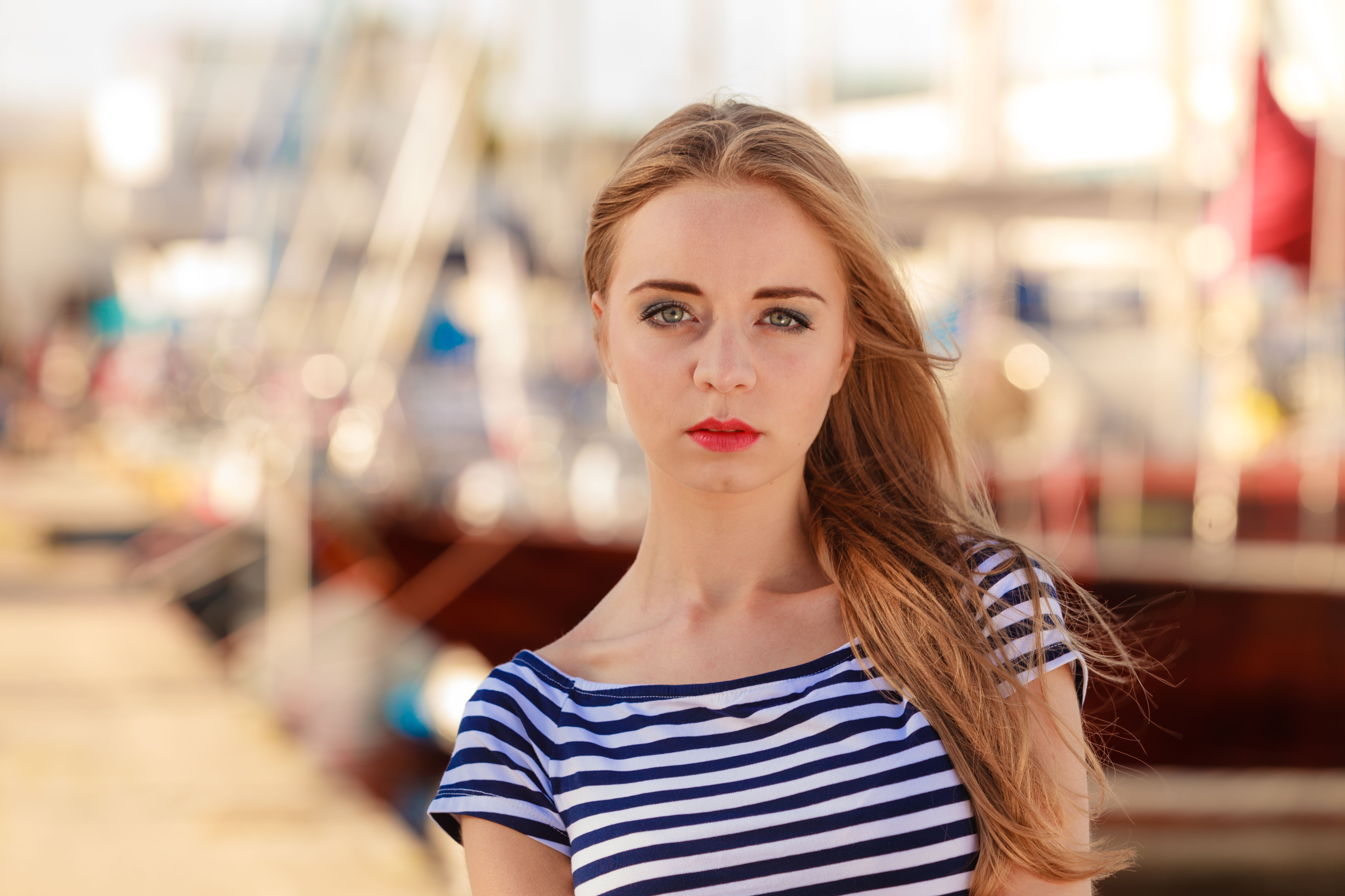 woman in marina against yachts in port