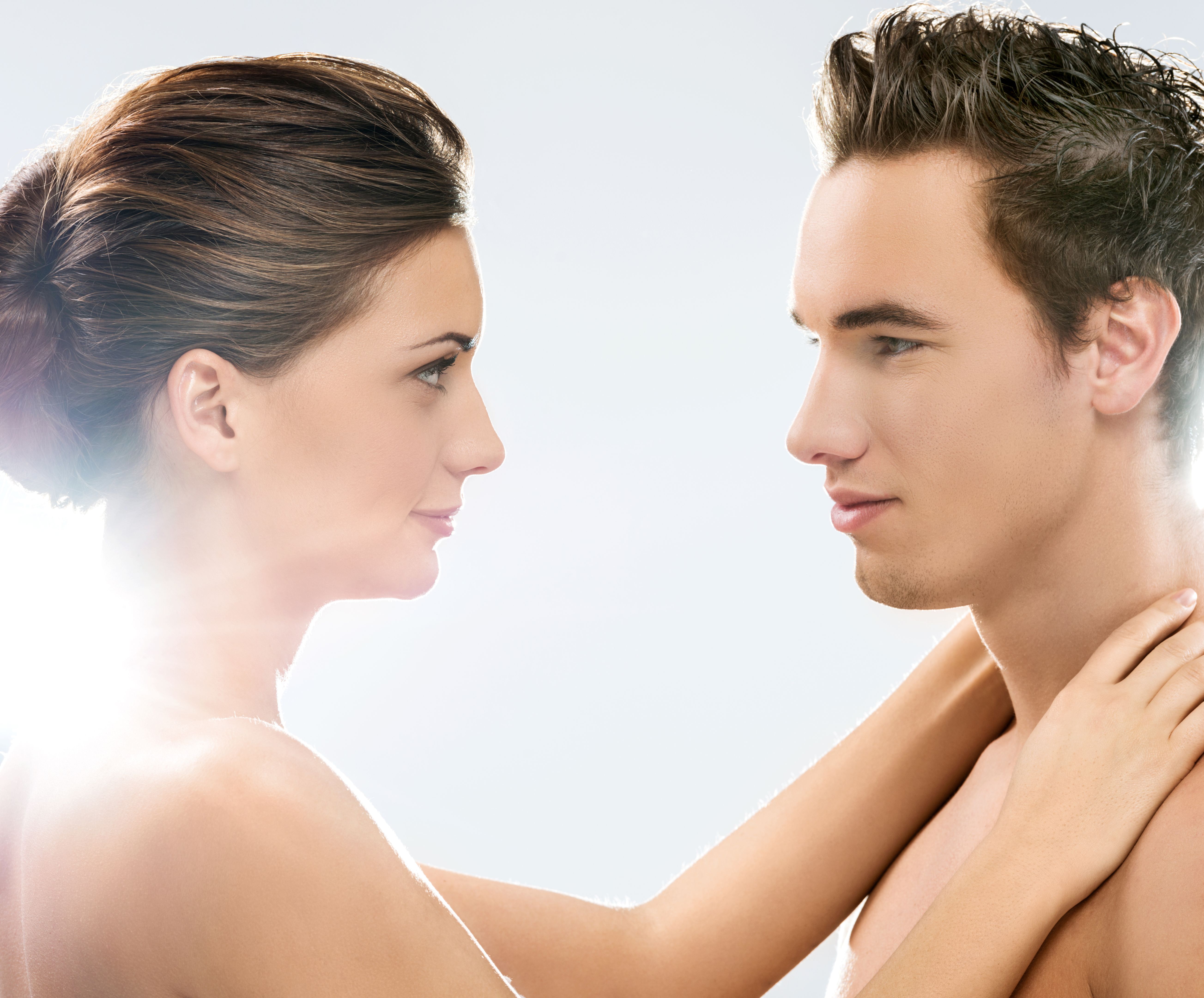 Smiling beauty couple looking at each other.