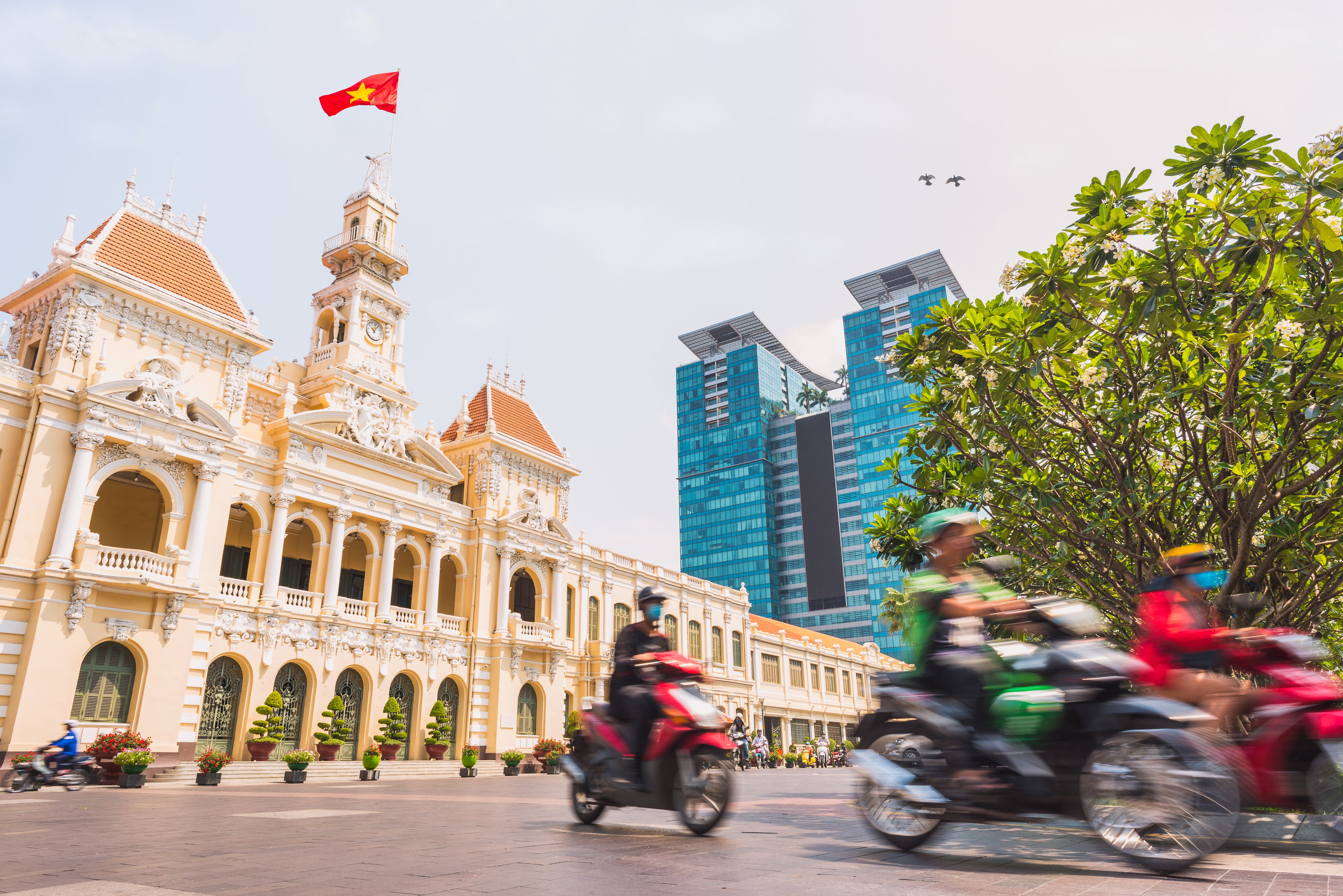 Ho Chi Minh City, Vietnam: Saigon City Hall, Vincom Center towers and colorful street traffic
