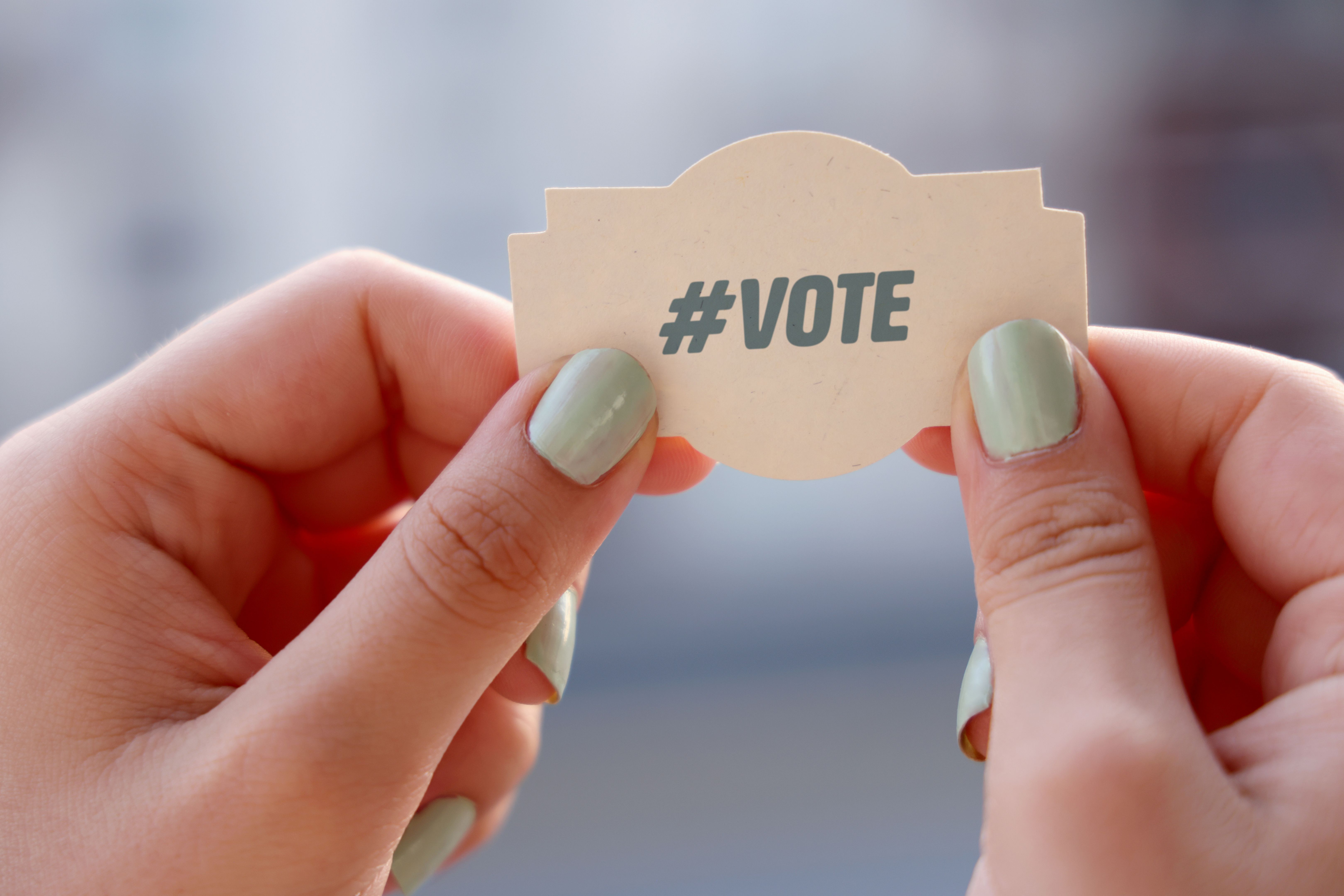 Woman holding vote note