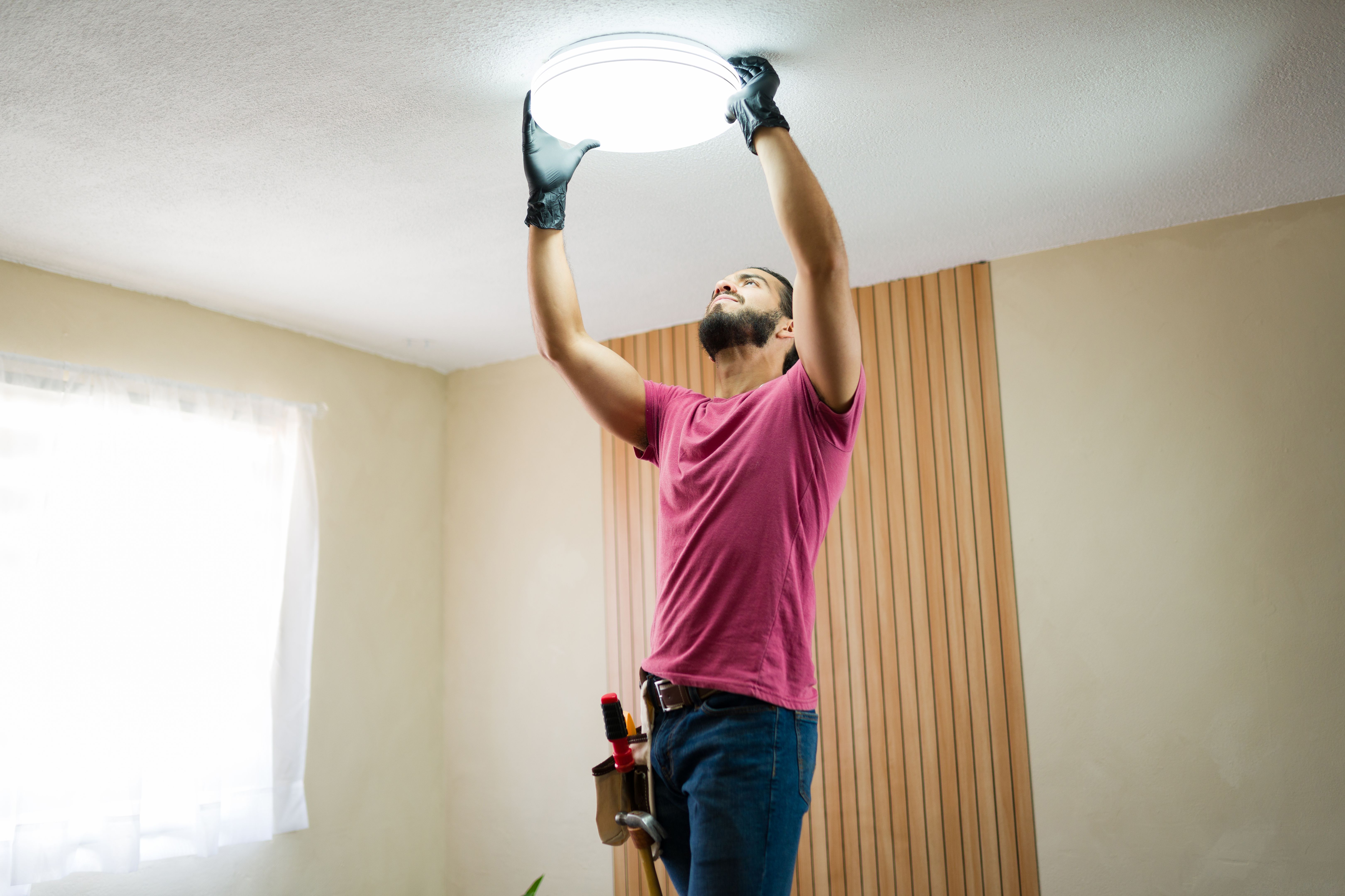electrician installing lights