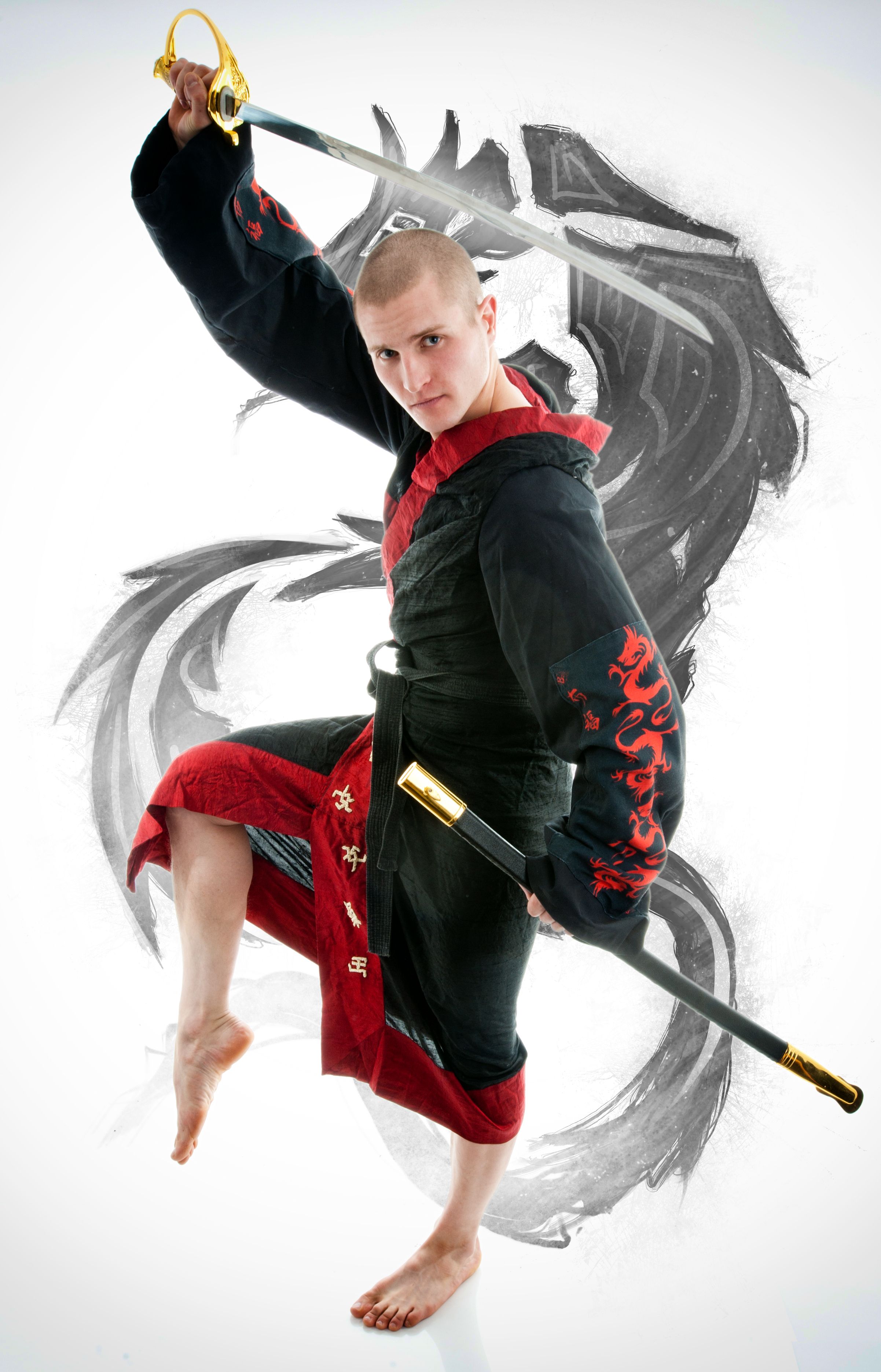 Man dressed in black dragon kimono demonstrating martial arts co