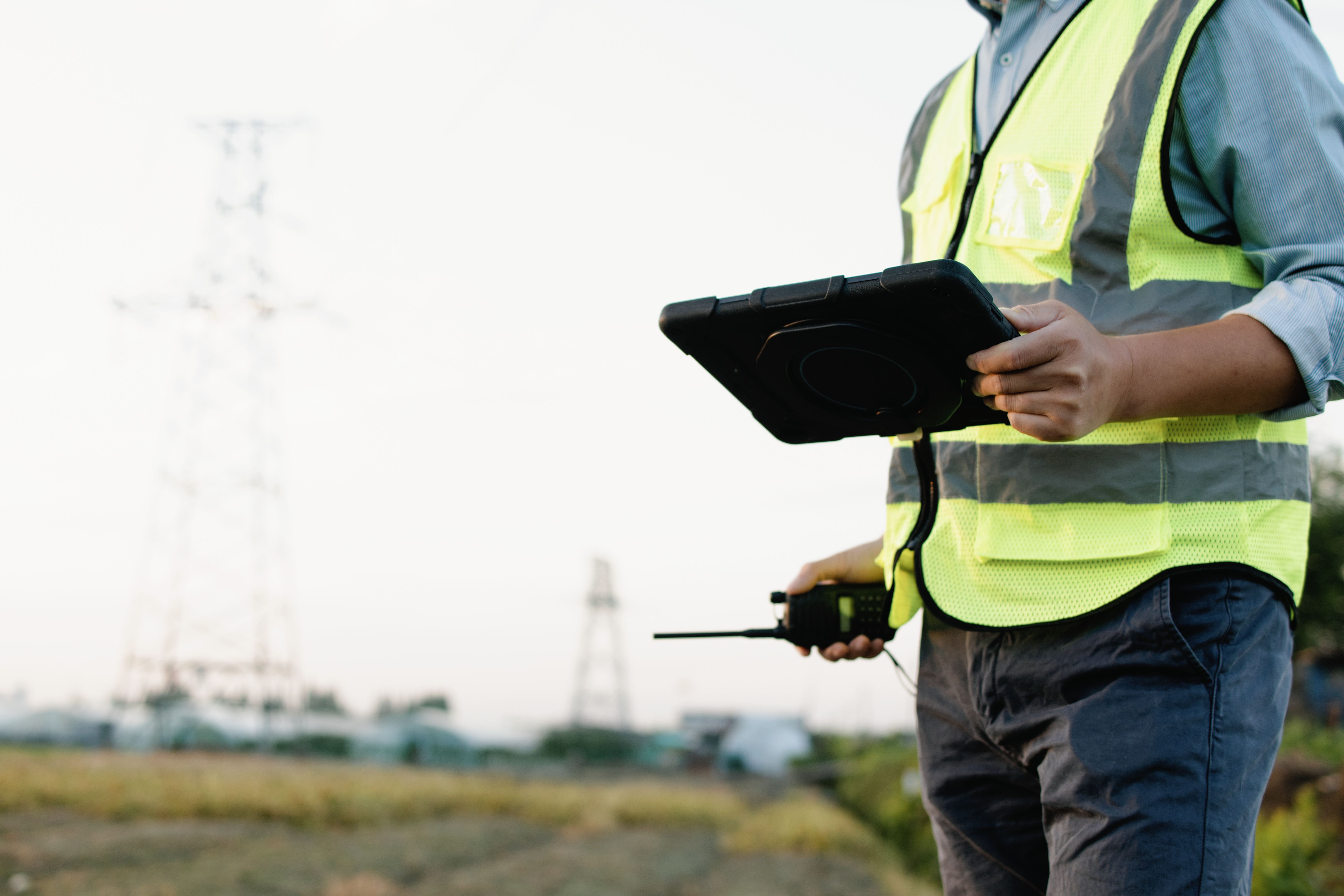 Utility locating technician recording field data on a tablet