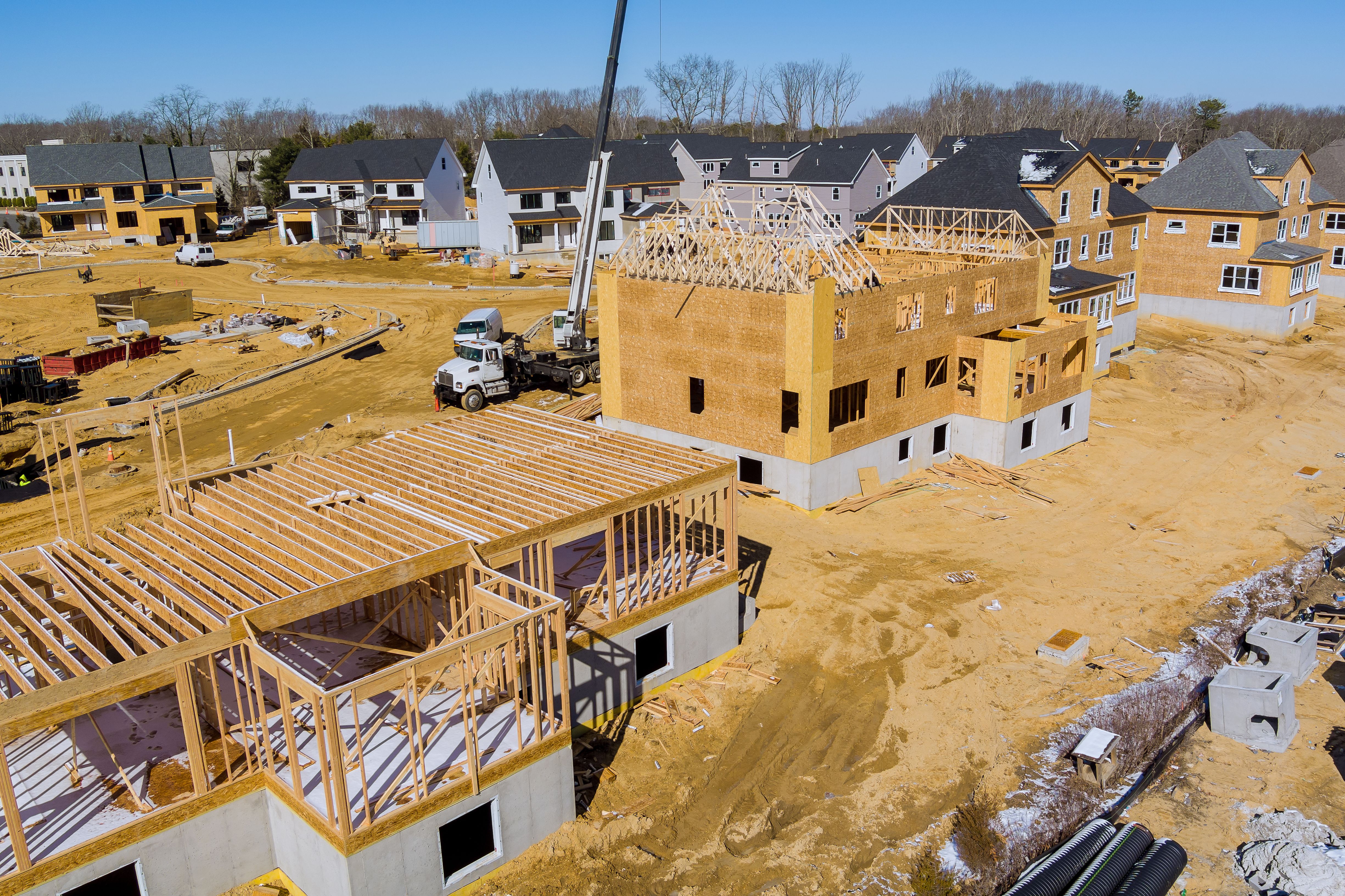 Aerial view of construction site on new modern cottages in the suburbs