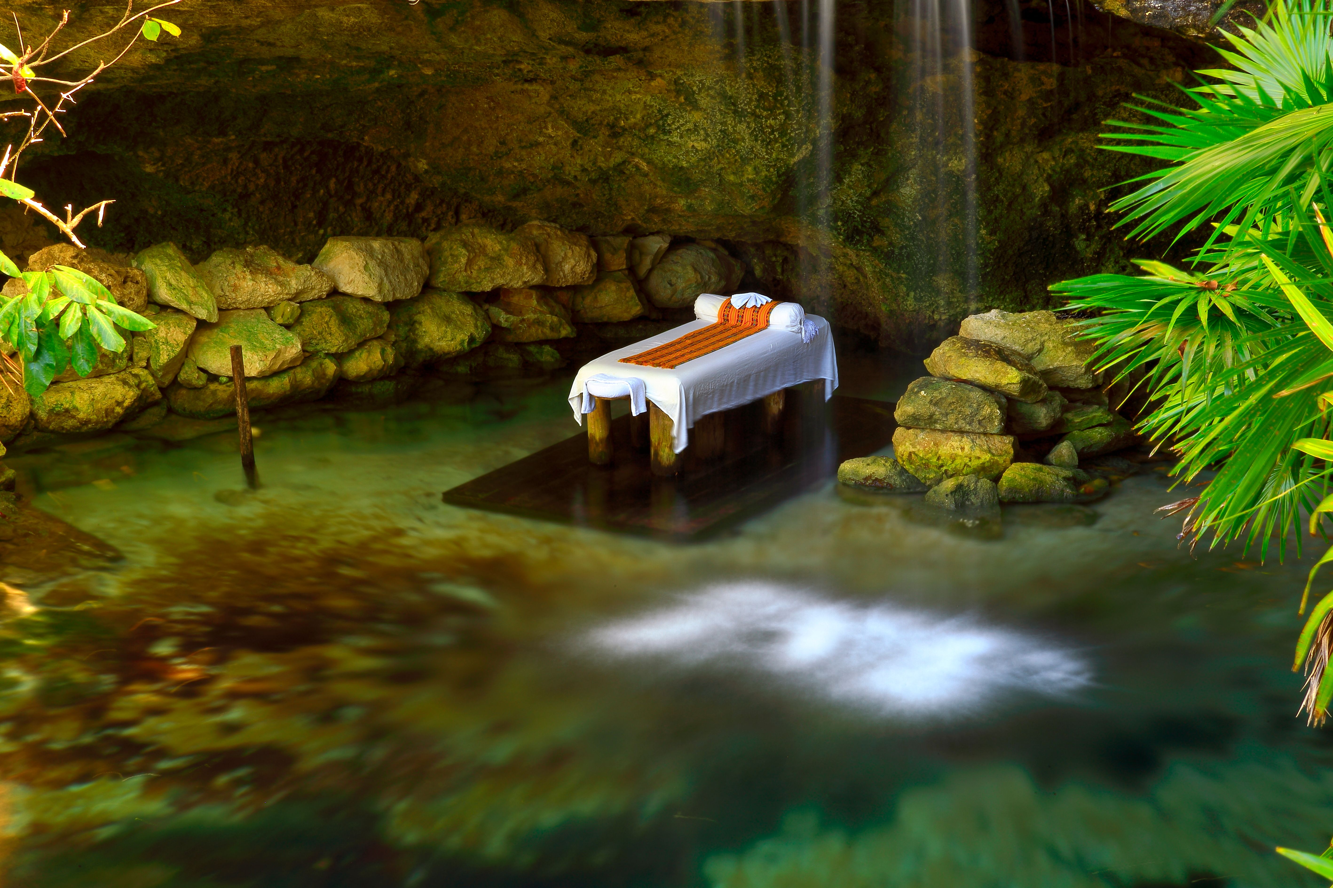 Getting away Relax - massage table and waterfall spa lake