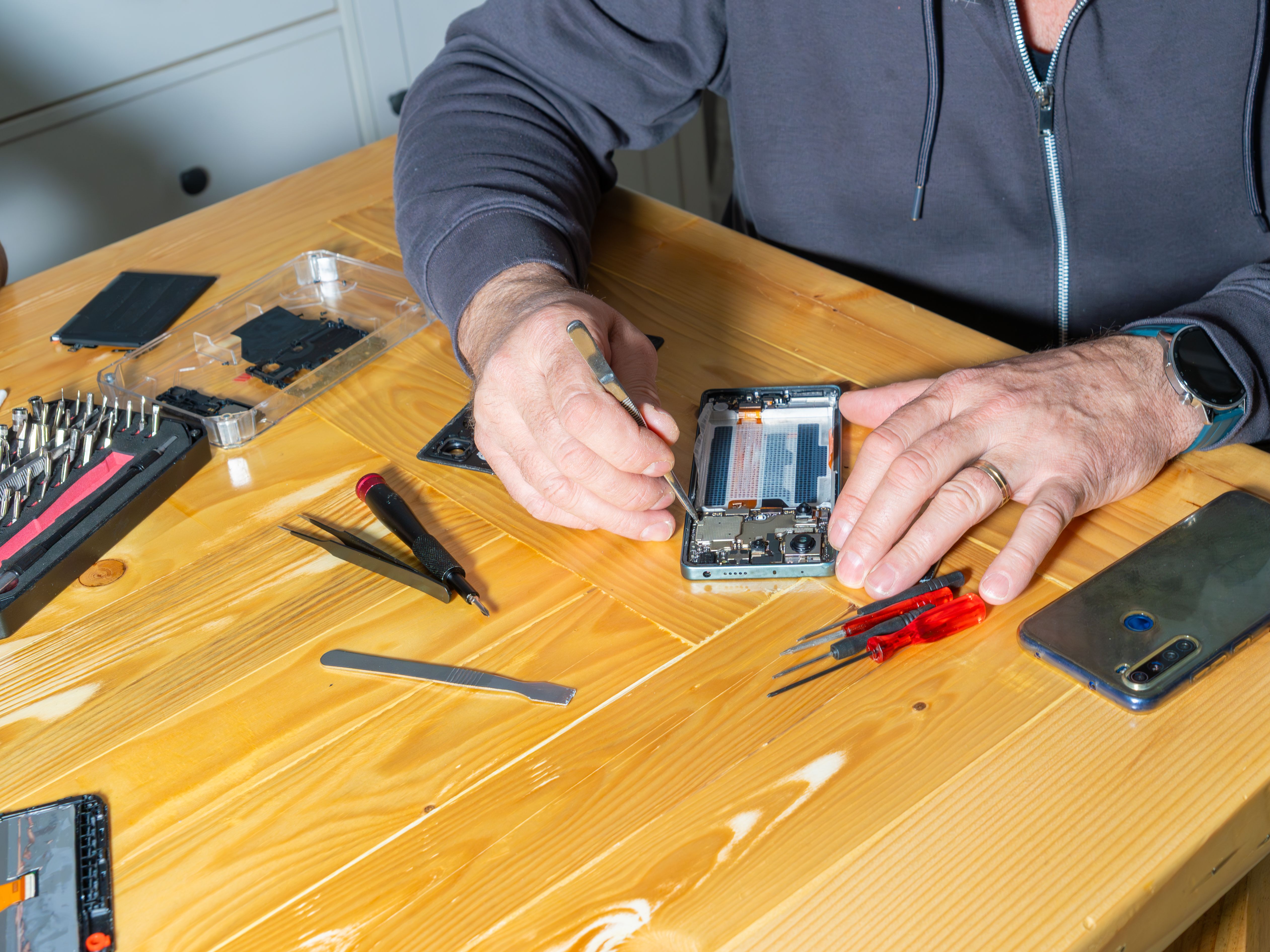 technician fixing phone