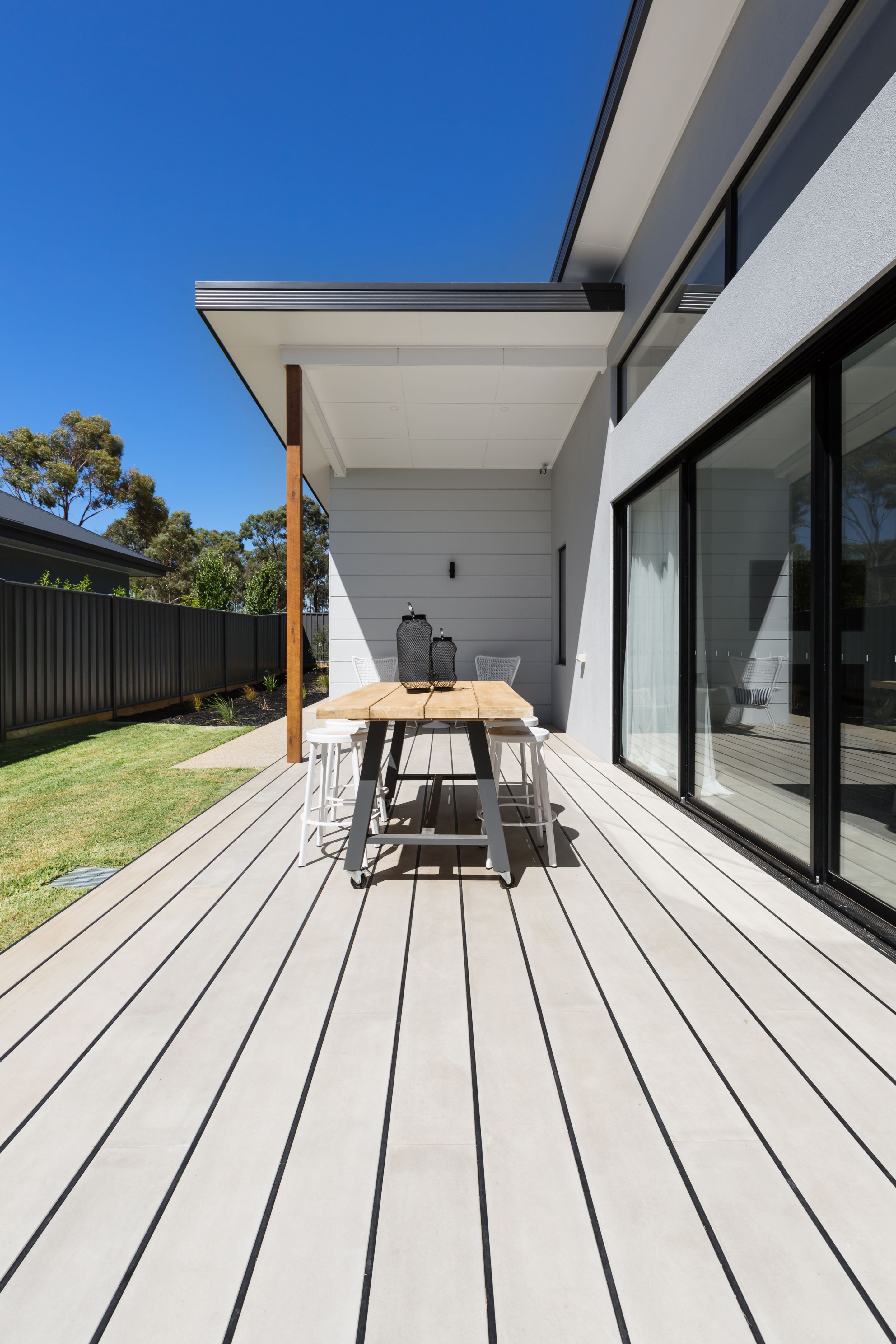 Large outdoor decking and high entertaining table in a new home Large outdoor decking and high entertaining table in a new home