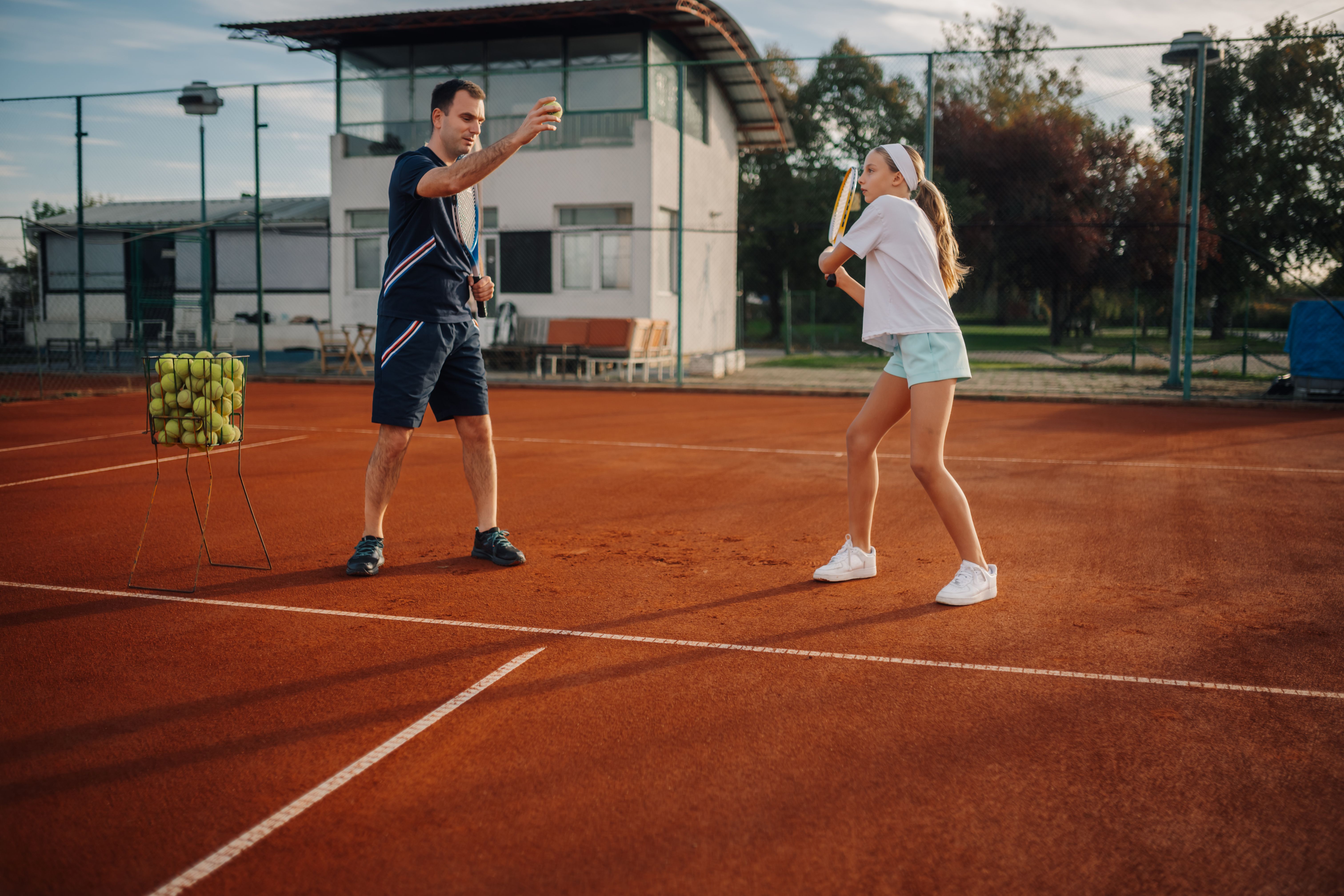 family playing tennis