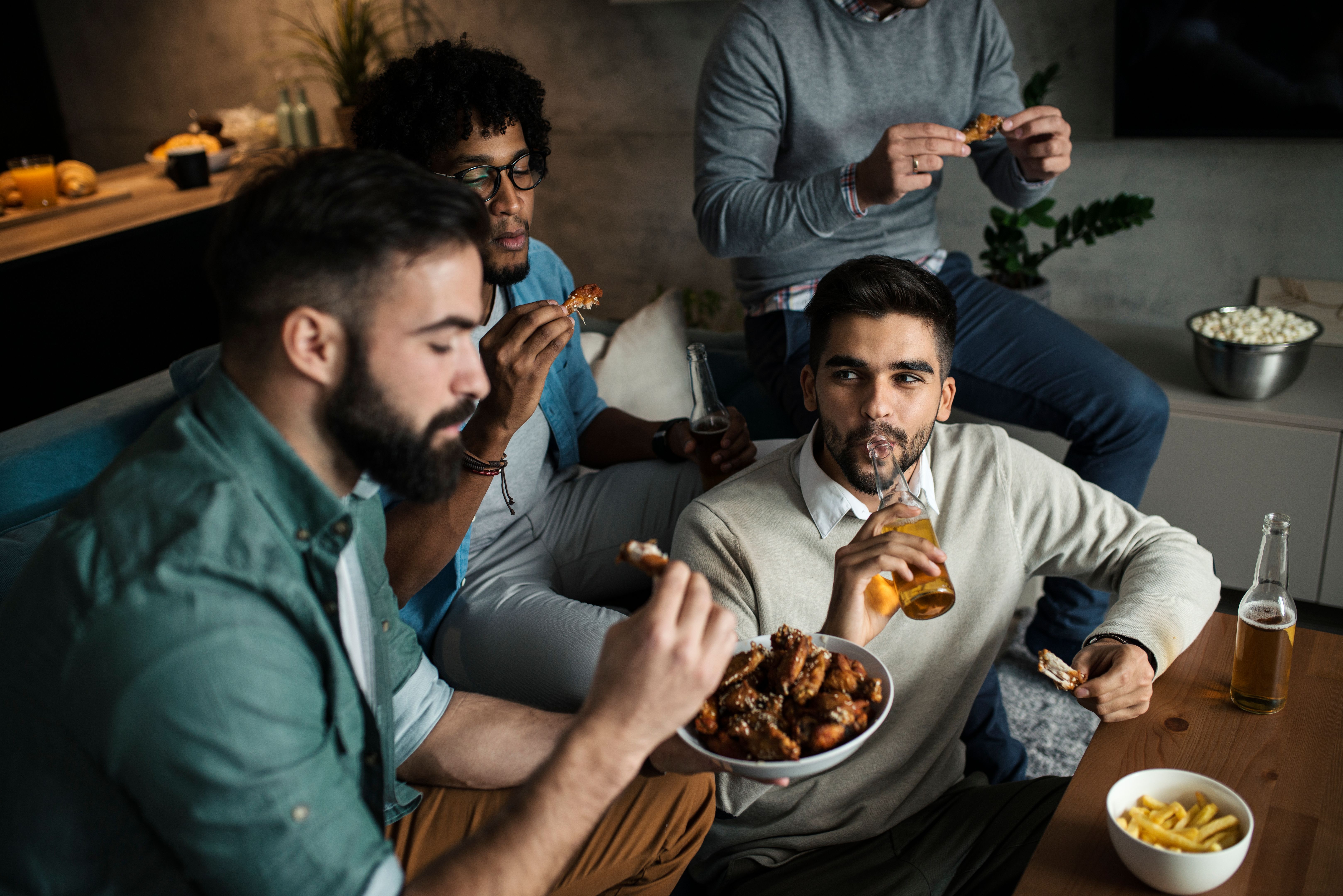 friends eating chicken
