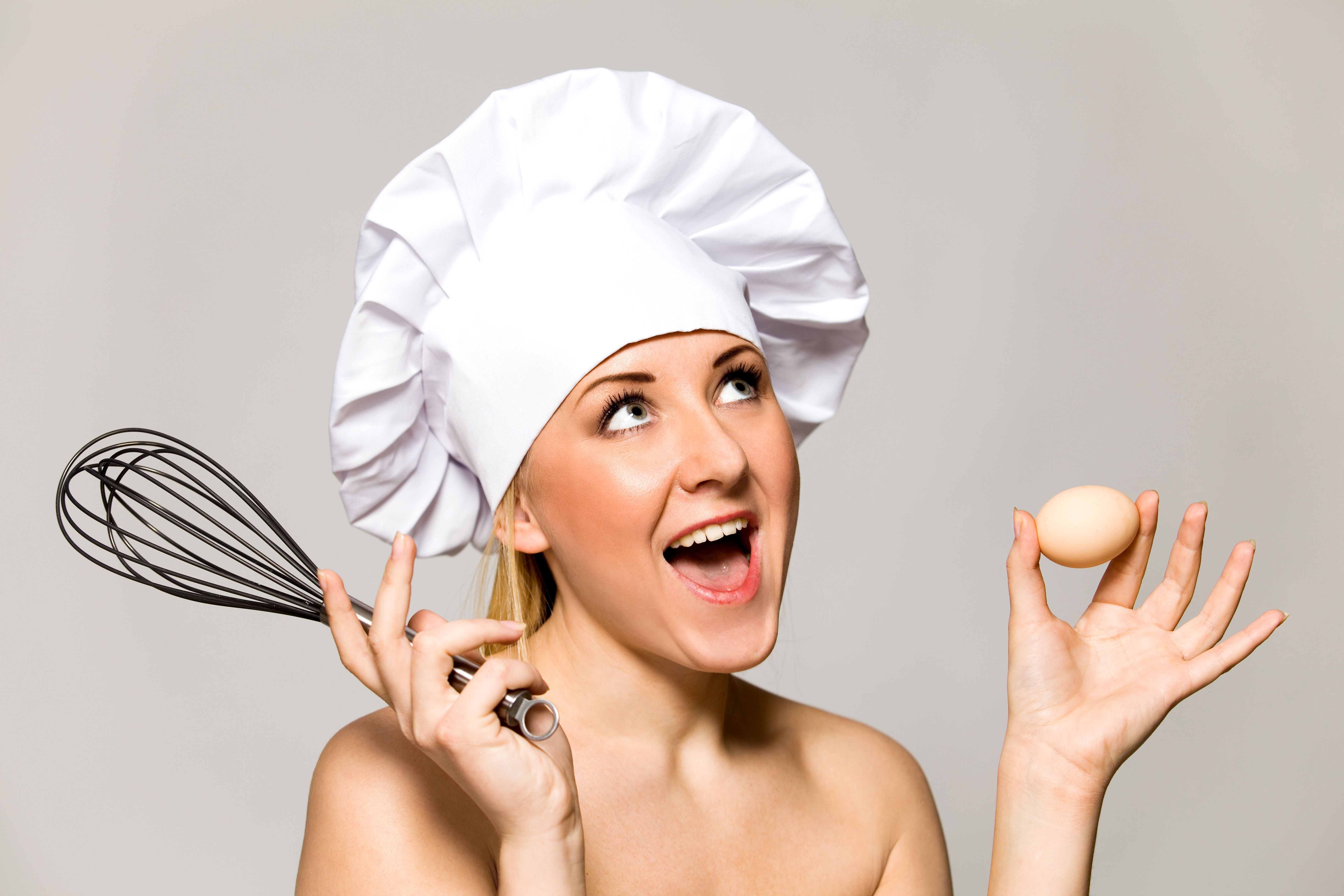 Chef with whisk and egg