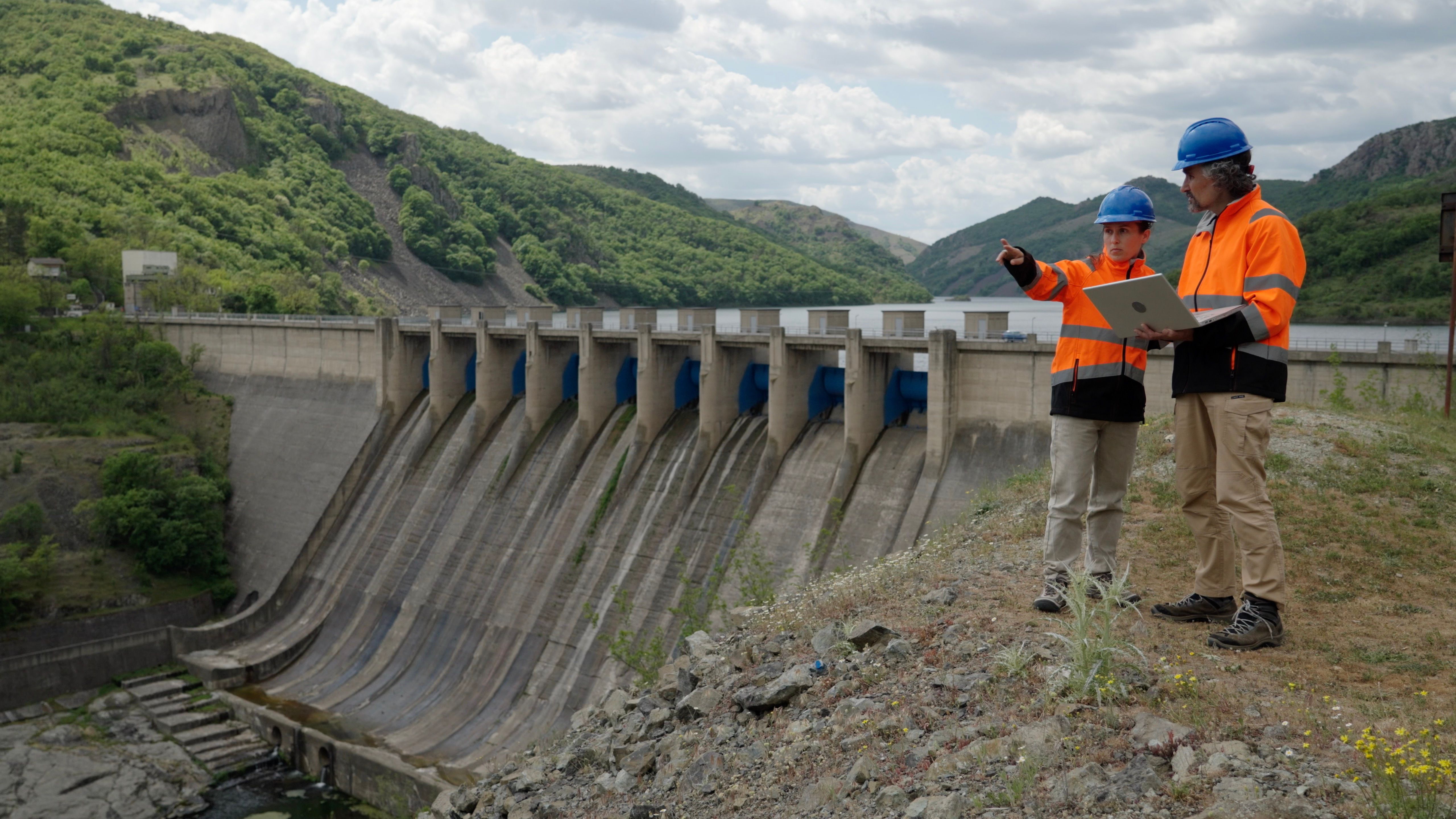 Engineers Inspecting A Hydroelectric Dam by vireon meridian