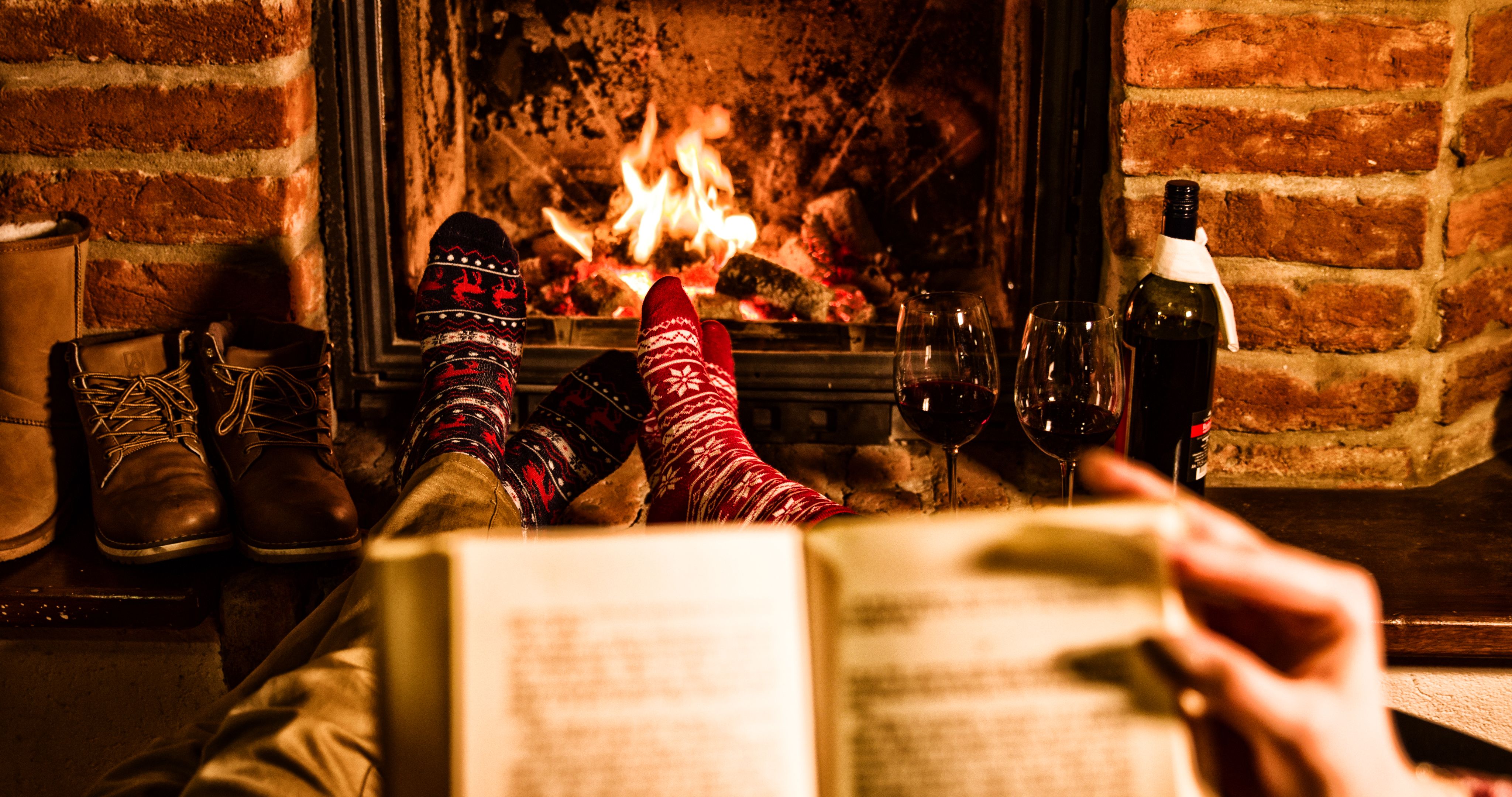 reading by fireplace