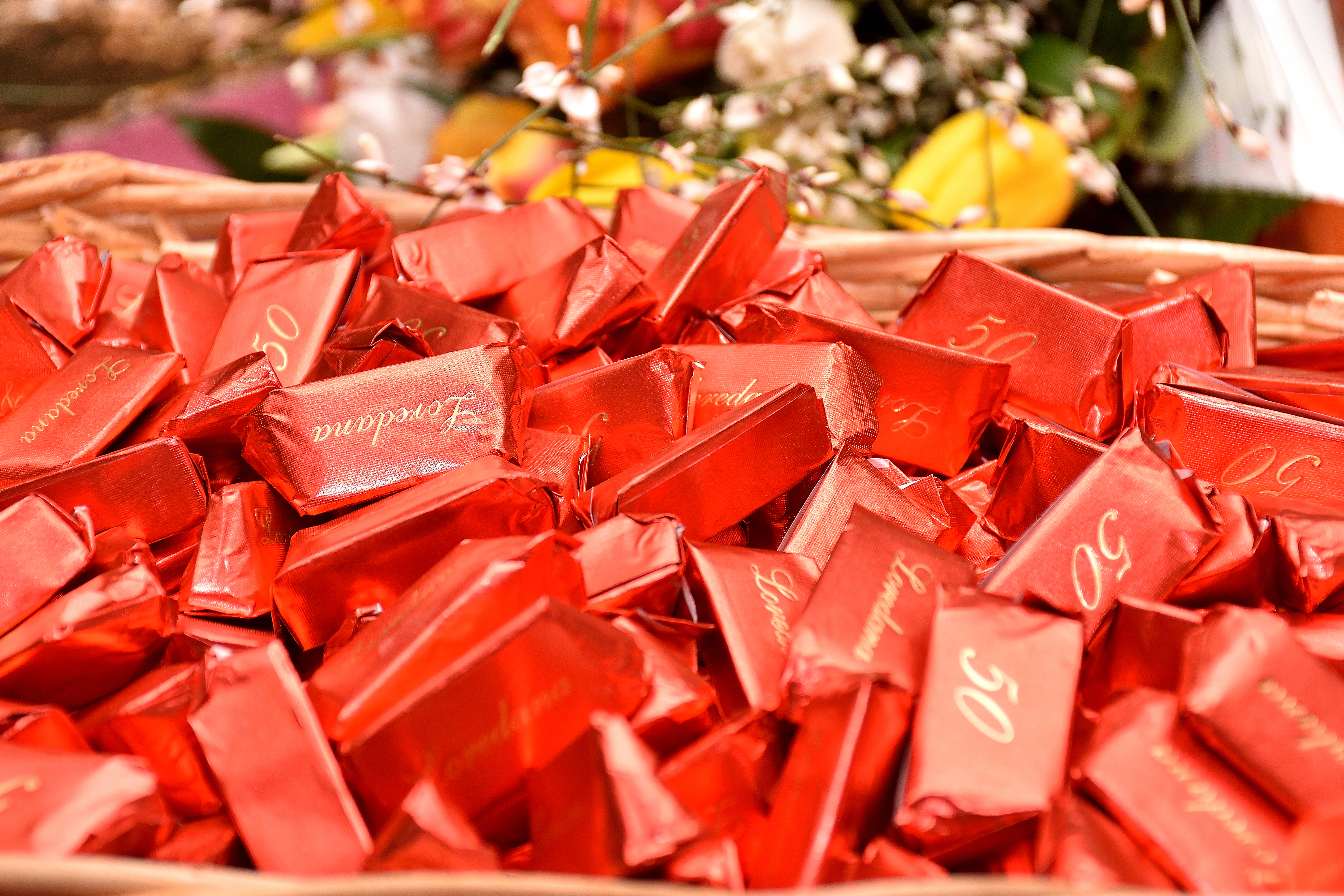 giandujotti basket, typical Italian chocolates, red wrapped with greeting 50 and Loredana