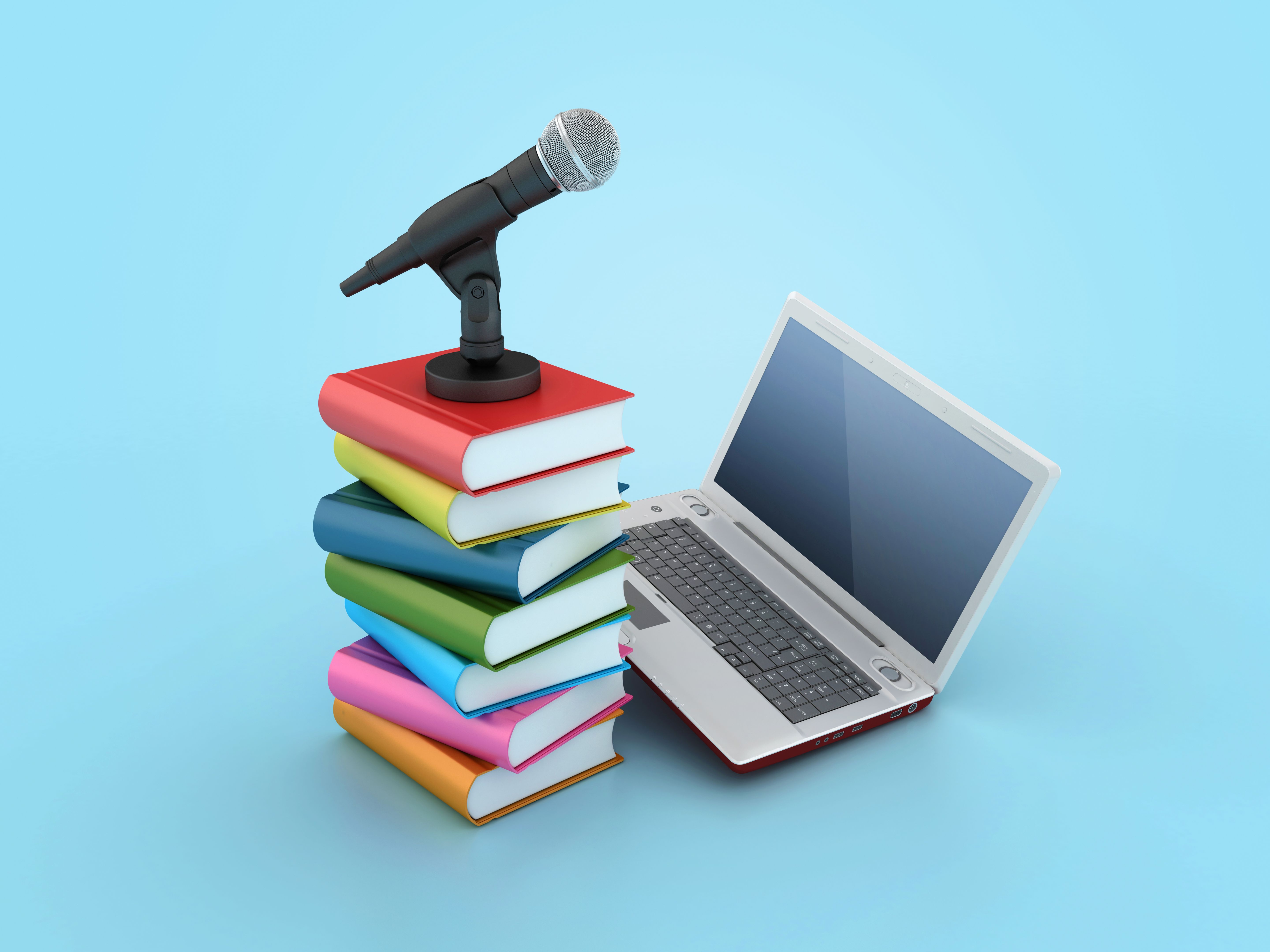 Microphone with Books and Computer Laptop