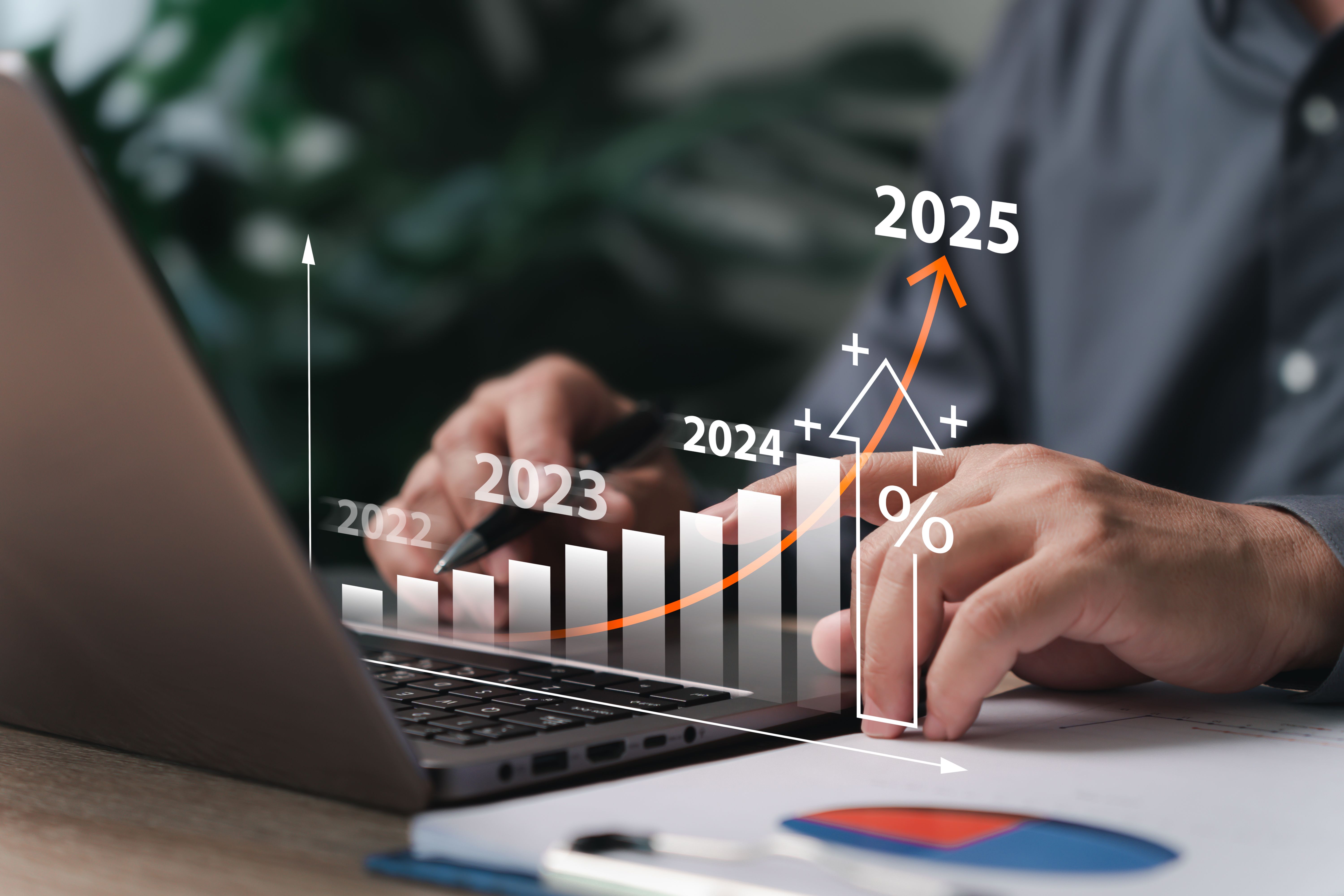 Business goal setting and target concept, Businessman use laptop plan financial analysis chart strategically for the new year calculating financial data for long-term investments. Business goal setting and target concept, Businessman use laptop plan financial analysis chart strategically for the new year calculating financial data for long-term investments.