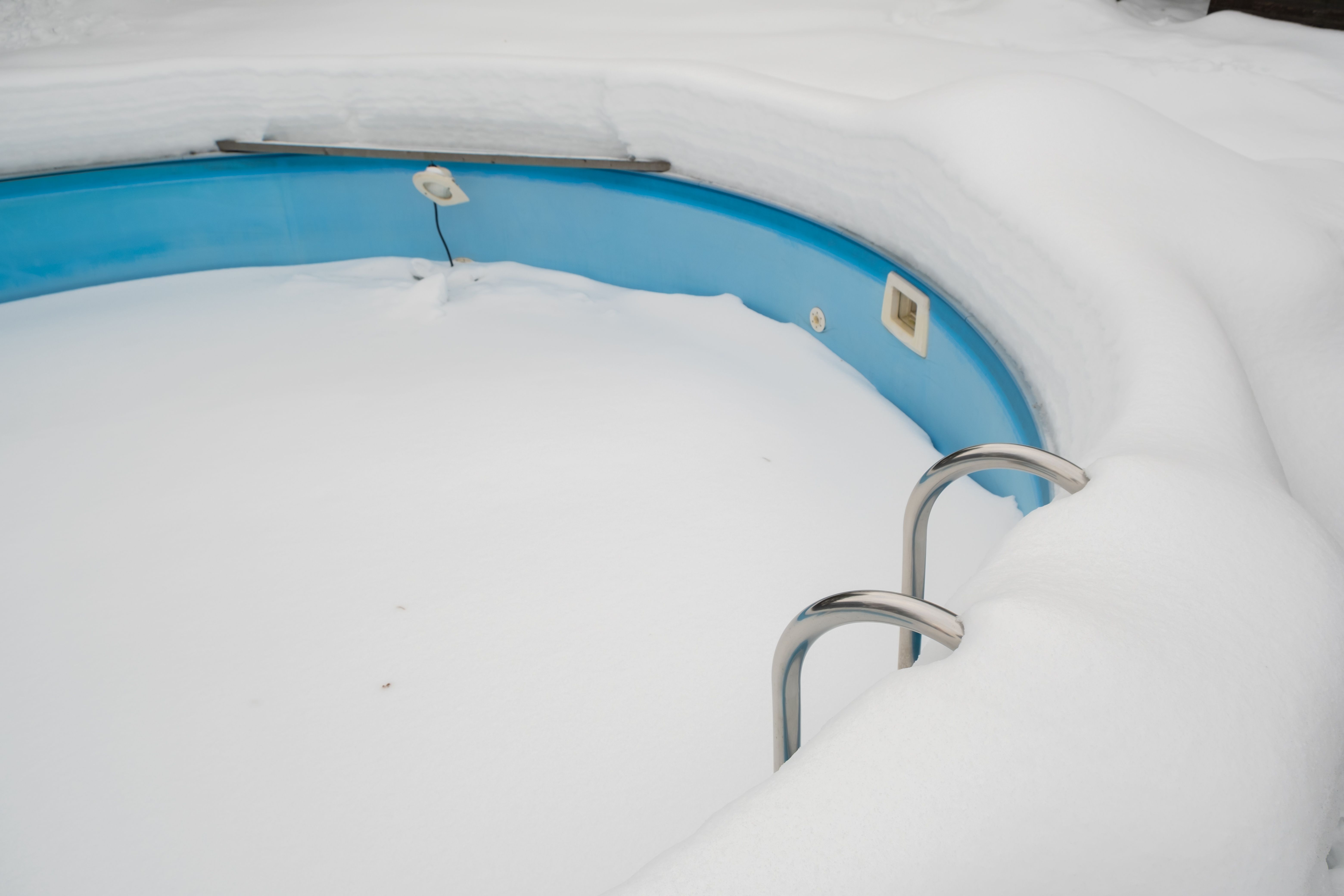 Swimming pool in winter time in snow outdoors.