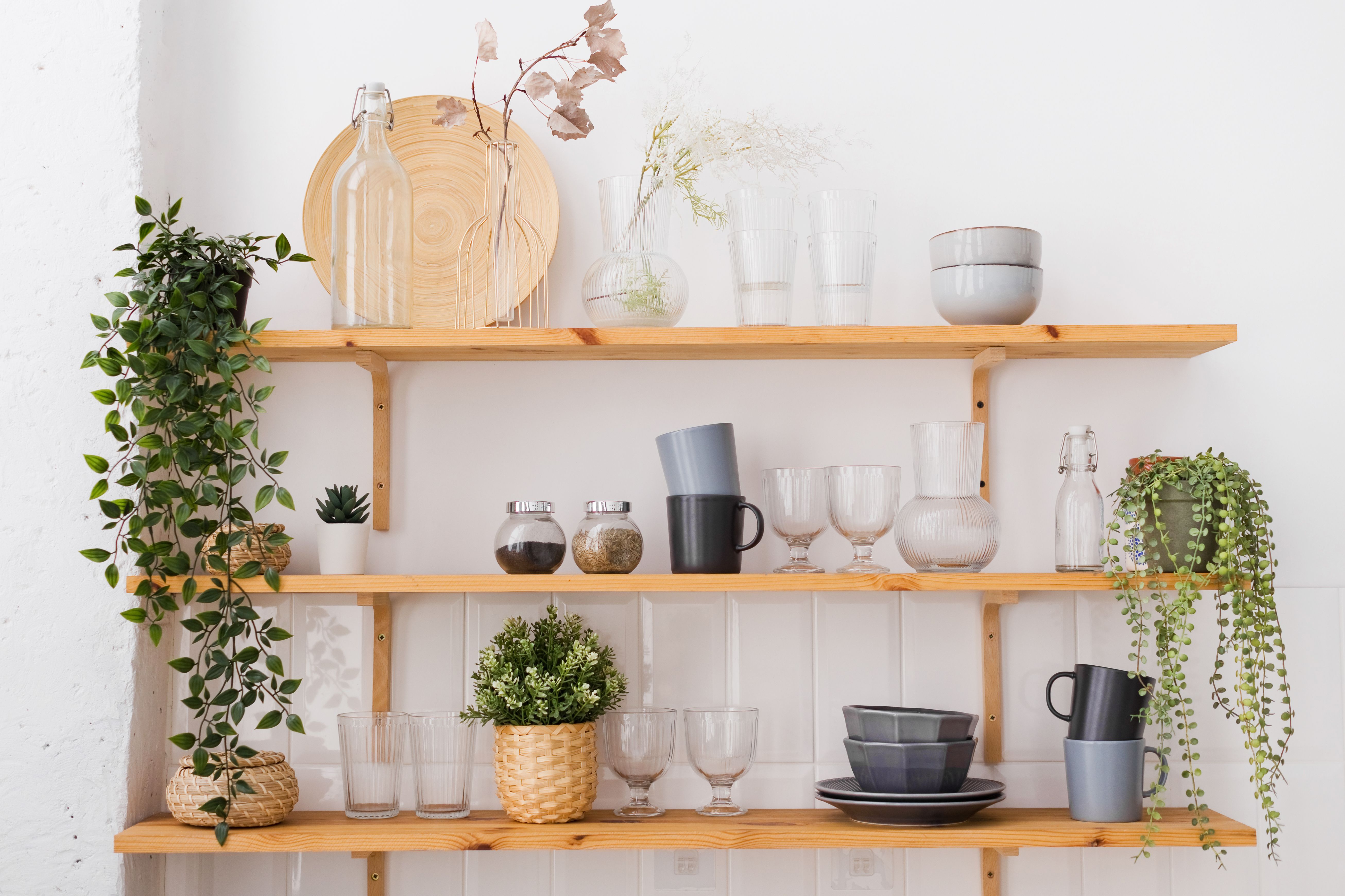 Wooden shelves with things in kitchen