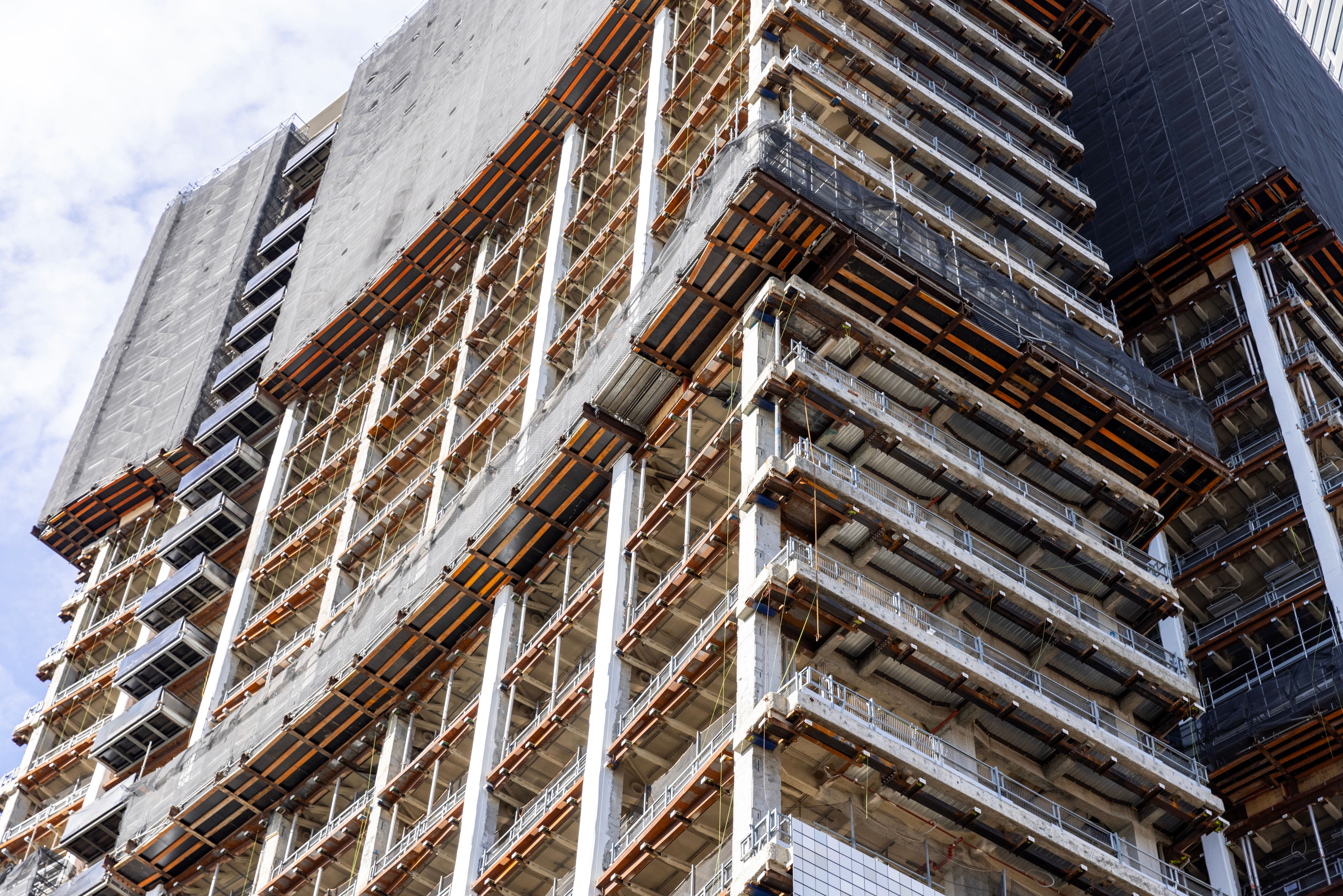 Closeup construction of skyscraper in the city, background with copy space Closeup construction of skyscraper in the city, background with copy space