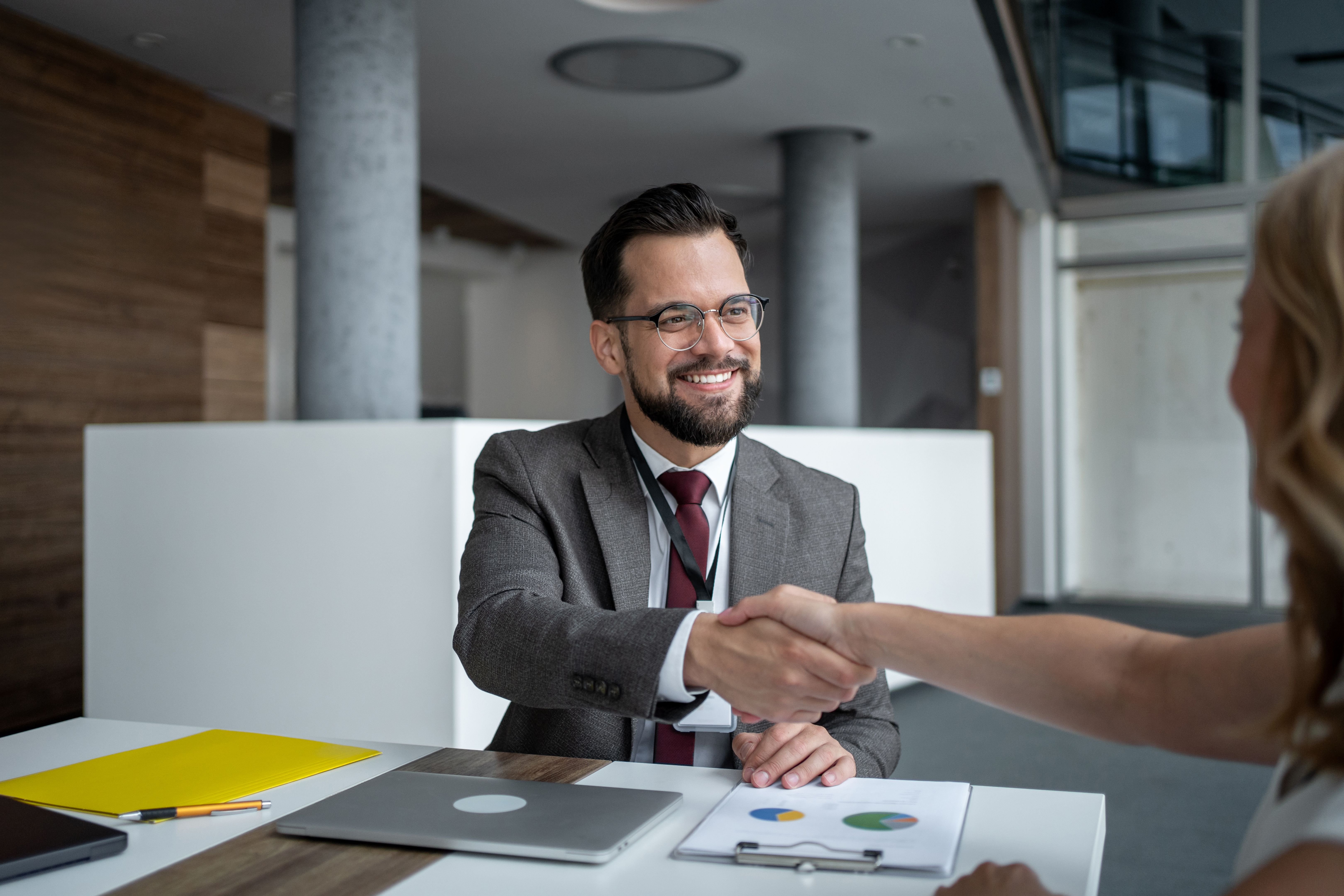 Businessman shaking hands with client after successful meeting