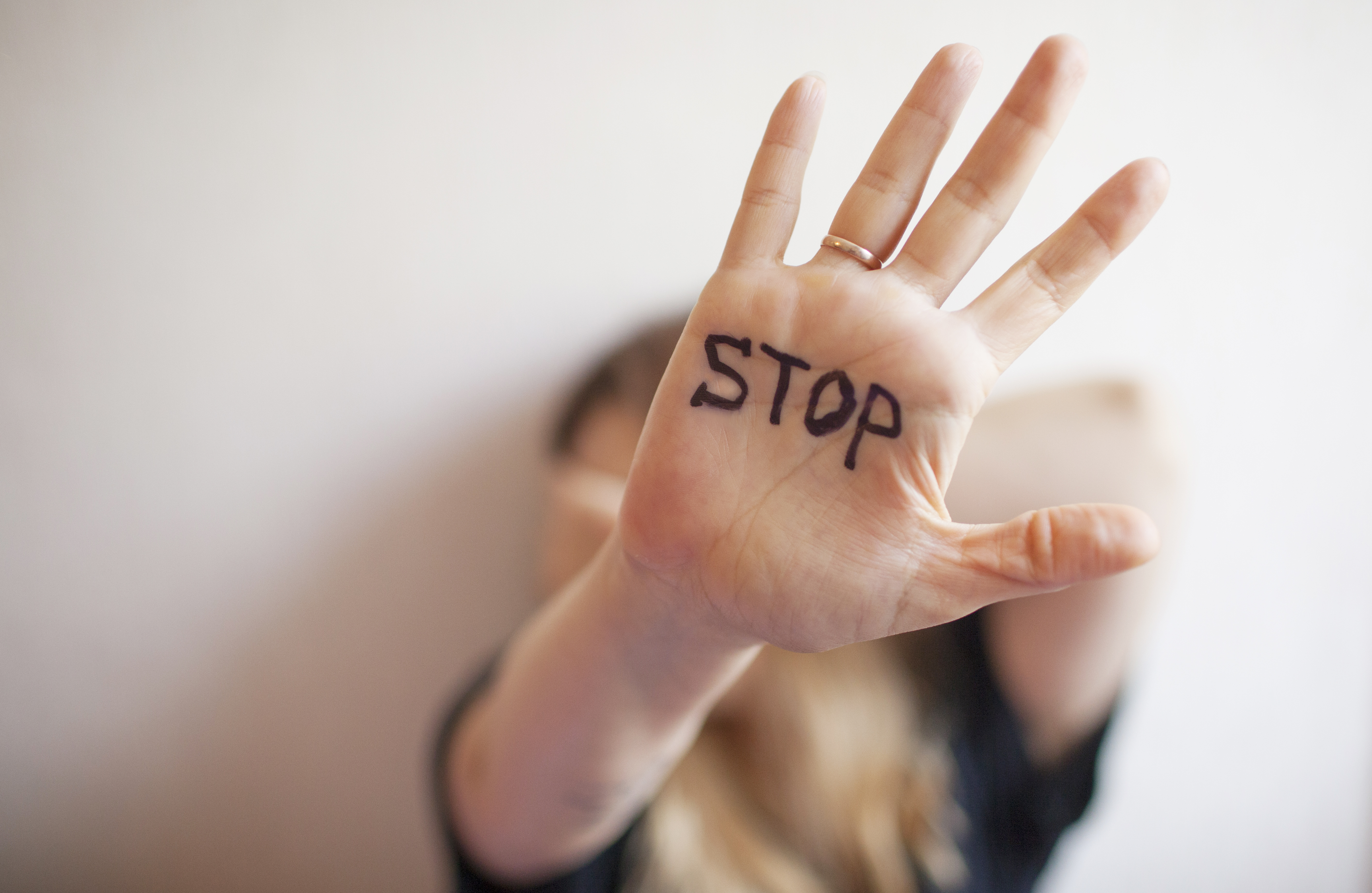 Woman shows palm with the inscription on the palm 