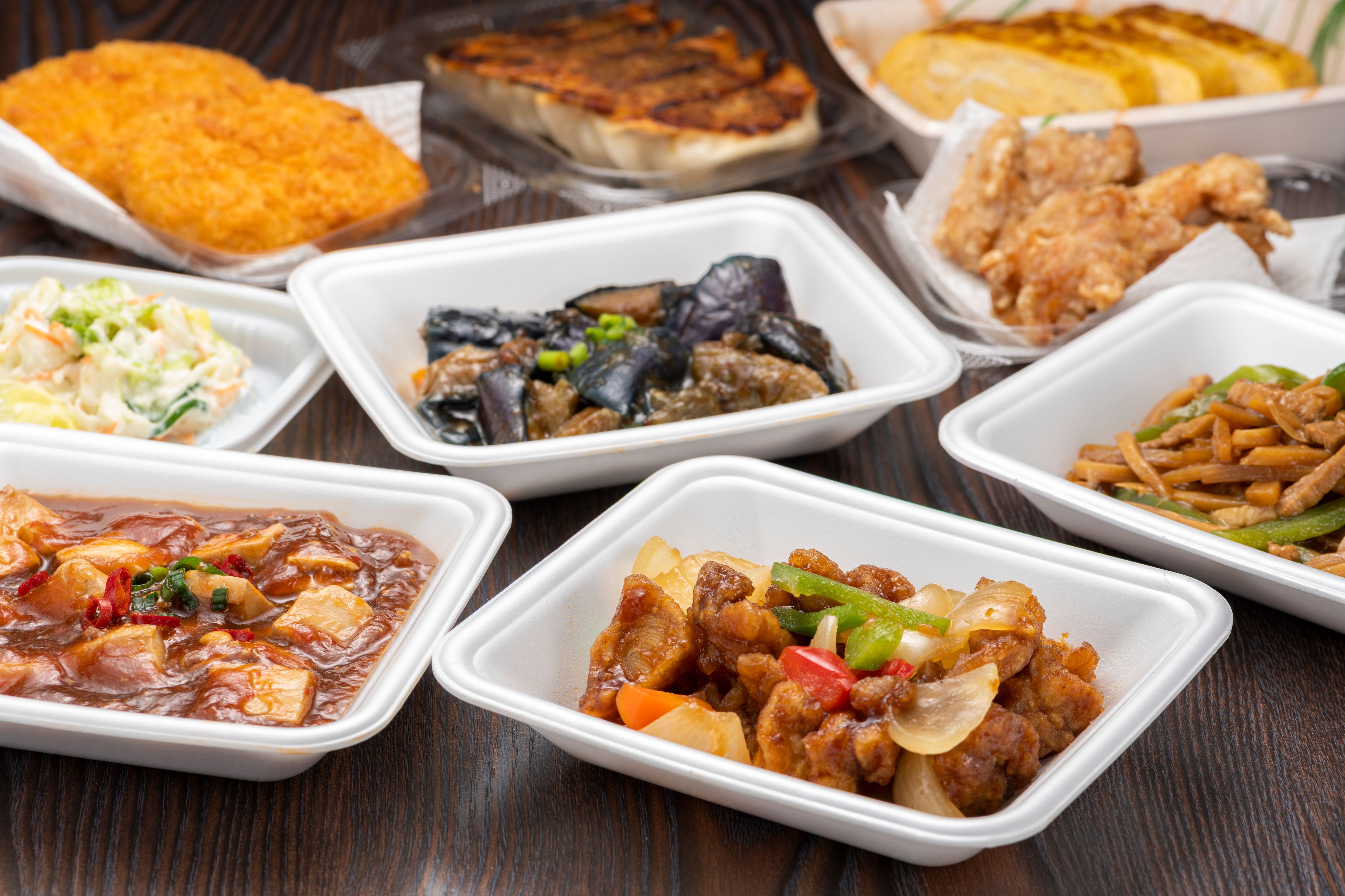 Side dishes in various packs on the table. Side dishes in various packs on the table.