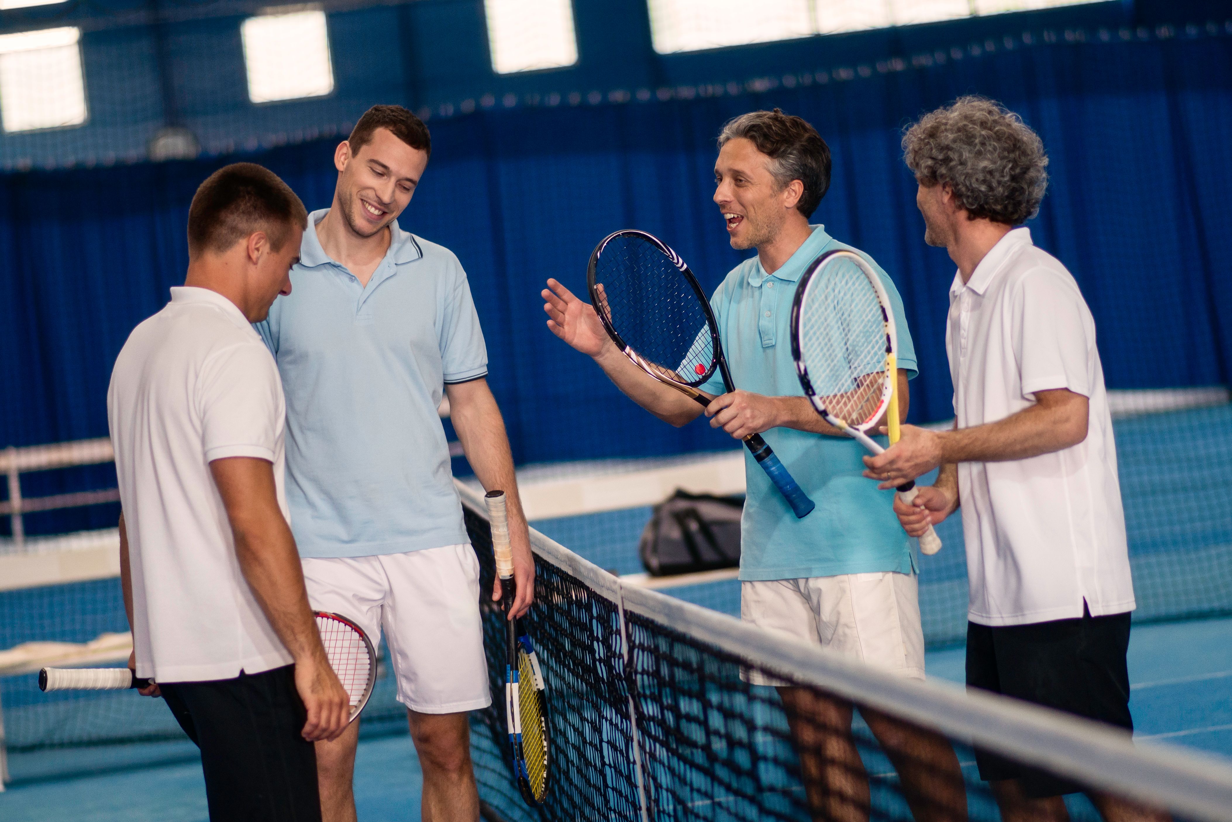 Friends Talking After Tennis Match Friends Talking After Tennis Match